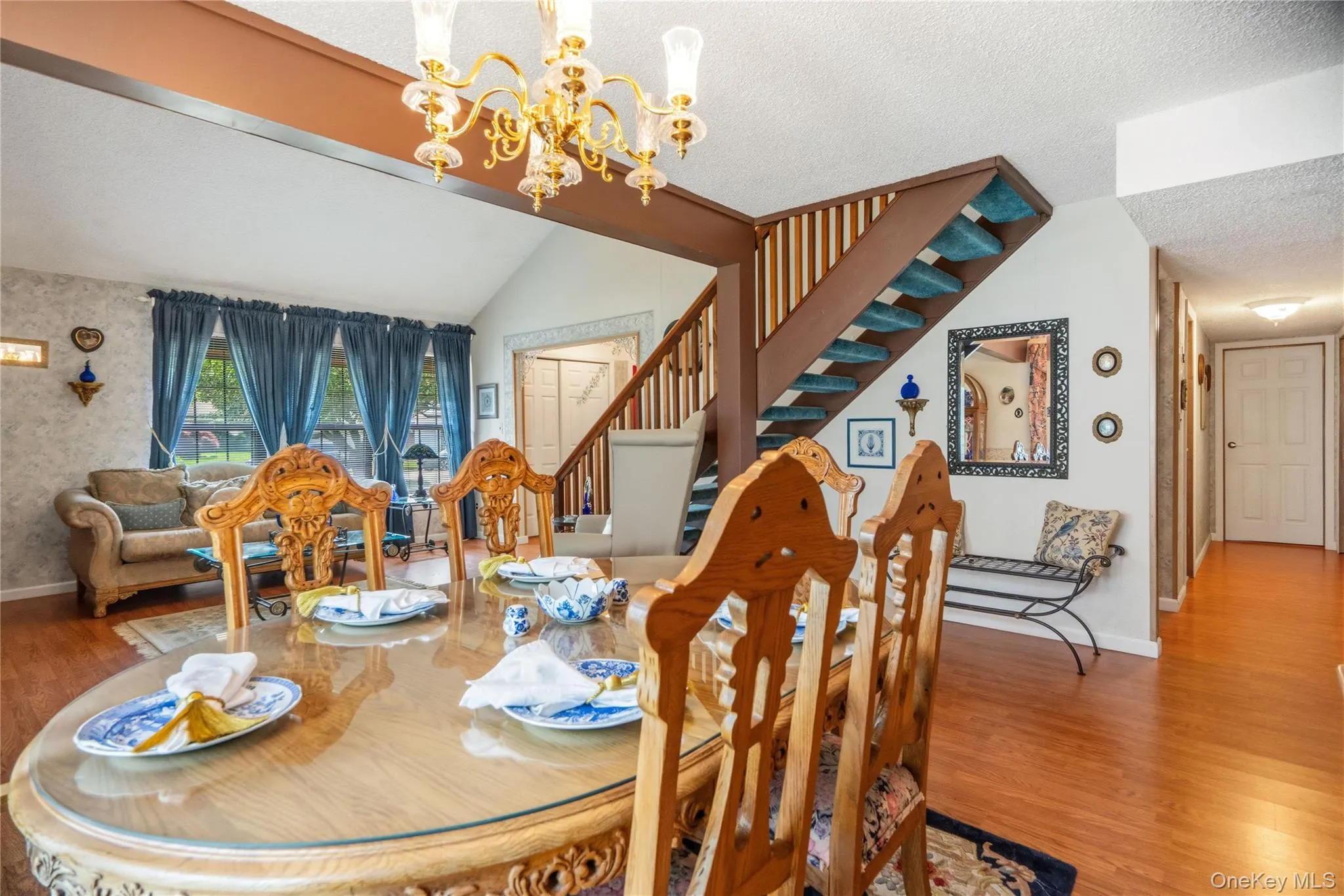 From the corner of the dining room looking across the kitchen entryway and down the south wing of the house to the bedrooms. From the corner of the dining room looking across the kitchen entryway and down the south wing of the house to the bedrooms.
