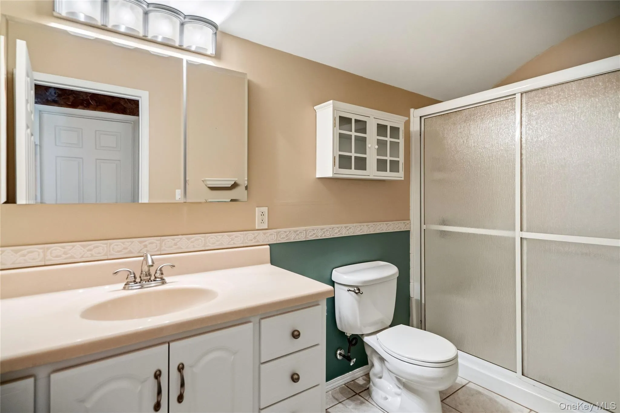 Off the top of the staircase is the 3rd bathroom, with a walk-in shower stall. Off the top of the staircase is the 3rd bathroom, with a walk-in shower stall.