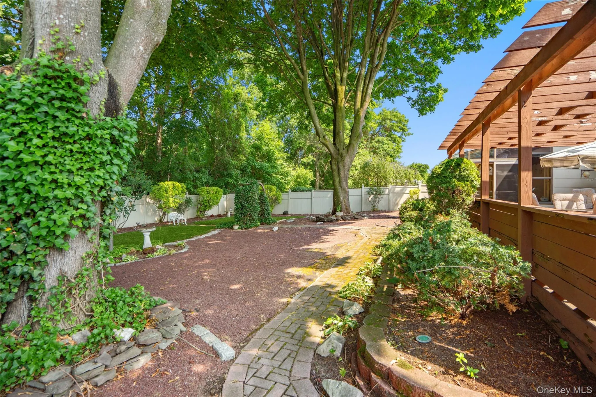 The pergola covered deck provides the perfect outdoor escape to entertain or relax while looking out to the peaceful & serene setting of the backyard. The pergola covered deck provides the perfect outdoor escape to entertain or relax while looking out to the peaceful & serene setting of the backyard.