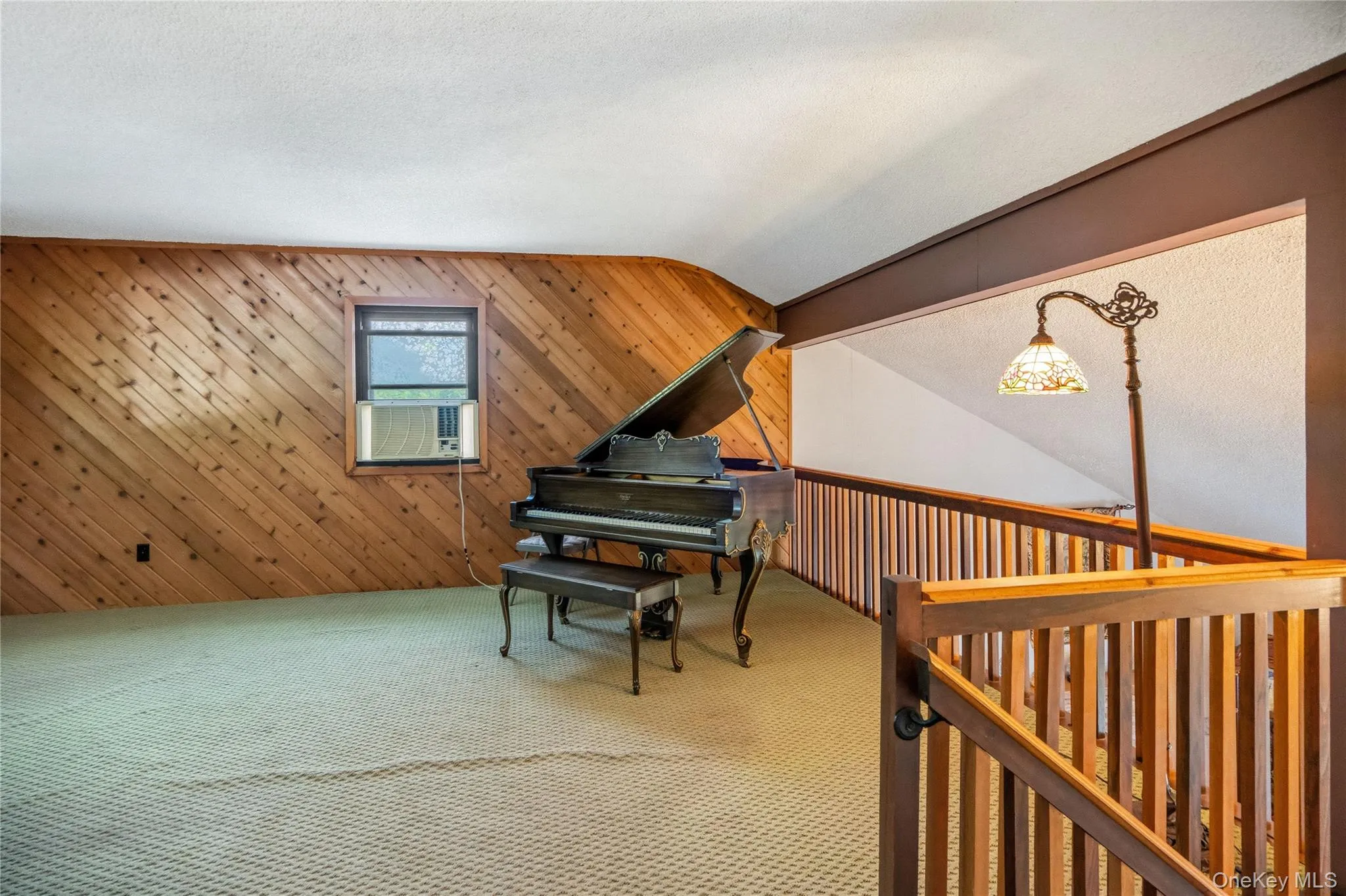 The balcony of the family room looks down into the living room and to the fireplace. The balcony of the family room looks down into the living room and to the fireplace.