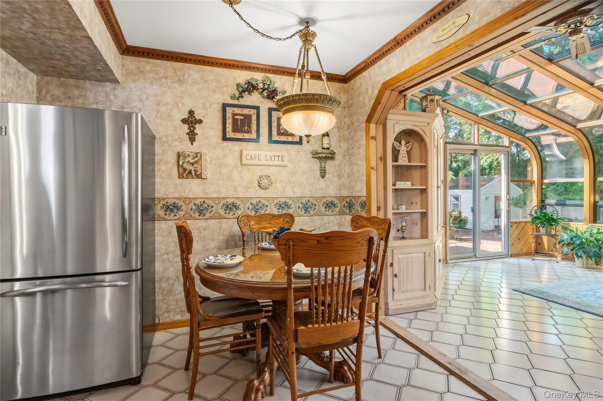 Exit the kitchen into the expansive sun room. Exit the kitchen into the expansive sun room.