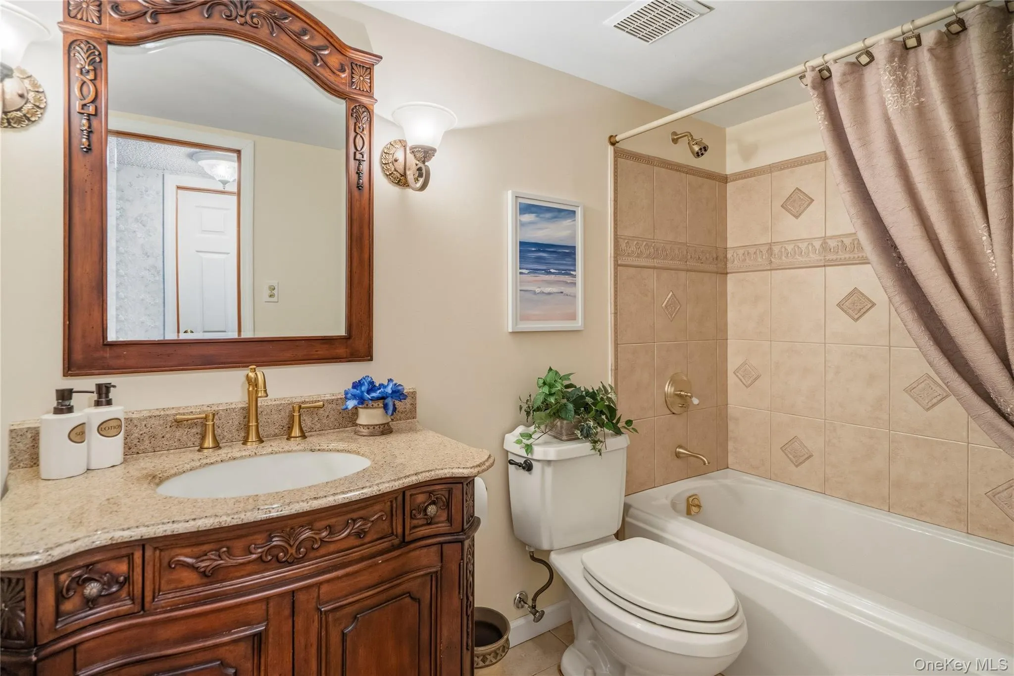 The hallway bathroom features a large wood vanity, mirror and full size soaking tub with a tiled enclosure. The hallway bathroom features a large wood vanity, mirror and full size soaking tub with a tiled enclosure.