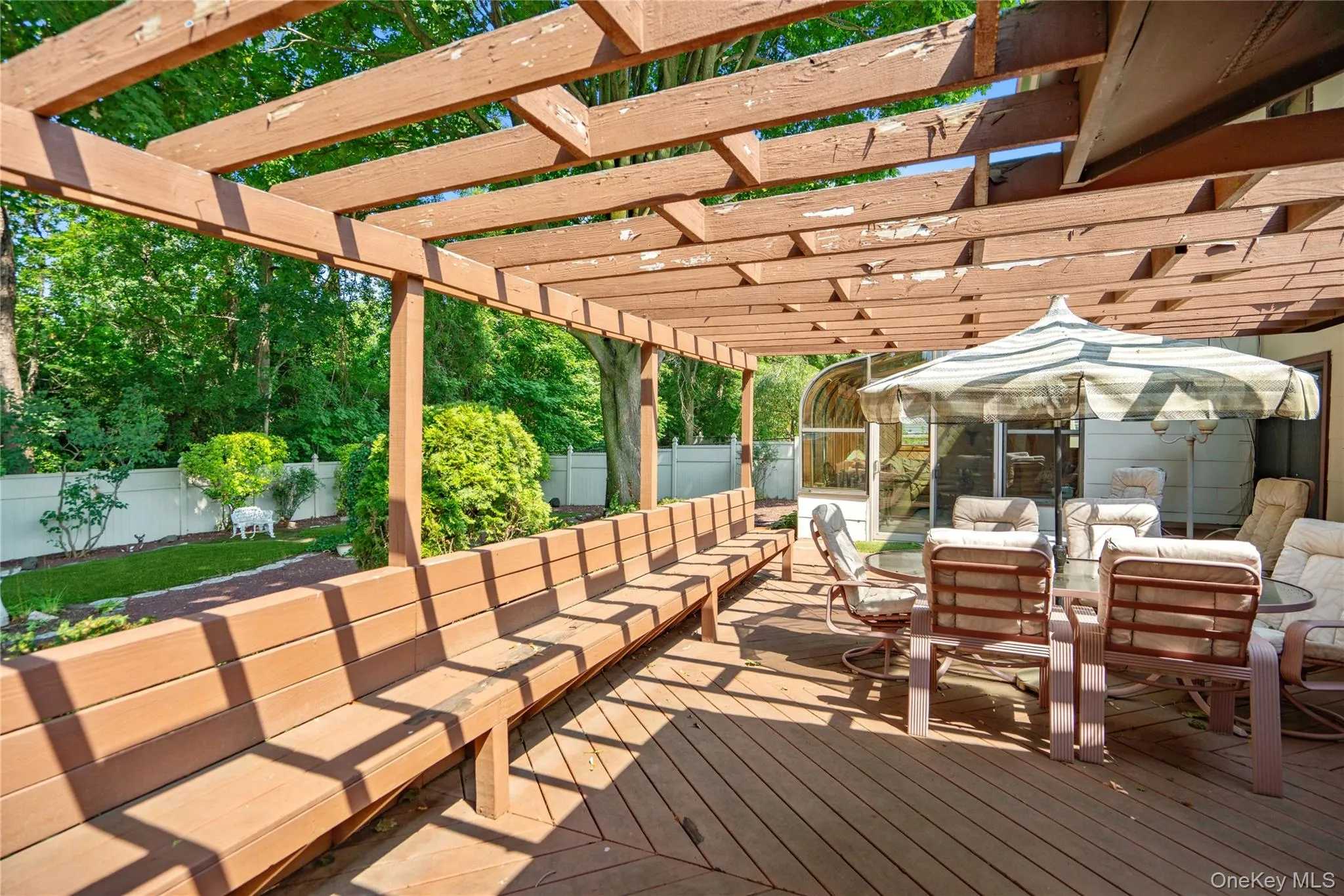 This spacious wood deck spans between the sun room and the sauna/hot tub room. It offers plenty of seating and an outdoor dining space. This spacious wood deck spans between the sun room and the sauna/hot tub room. It offers plenty of seating and an outdoor dining space.