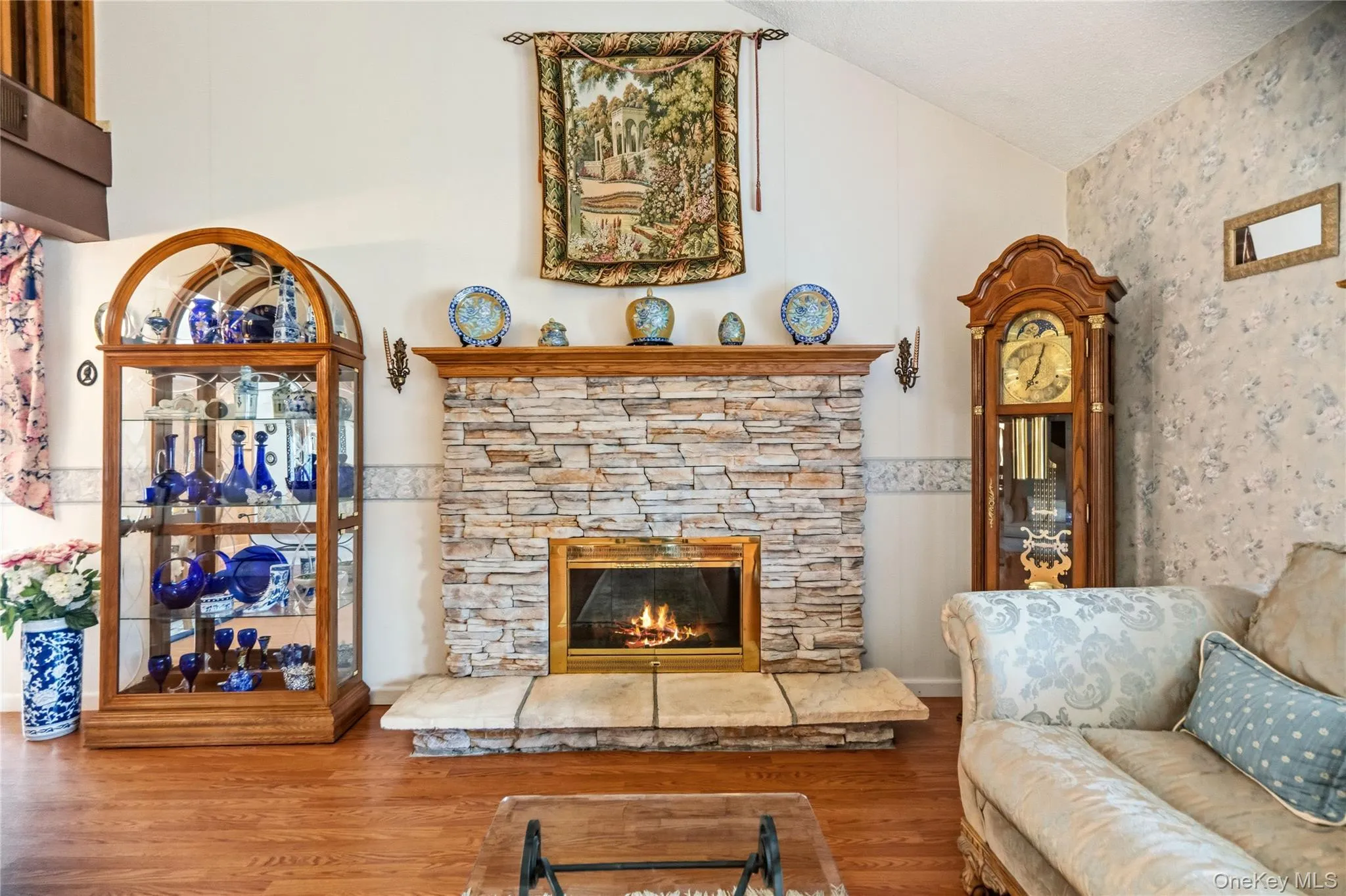 The focal point of the living room is the cultured stone faced, wood burning fireplace, with its wood mantle & raised hearth. The focal point of the living room is the cultured stone faced, wood burning fireplace, with its wood mantle & raised hearth.