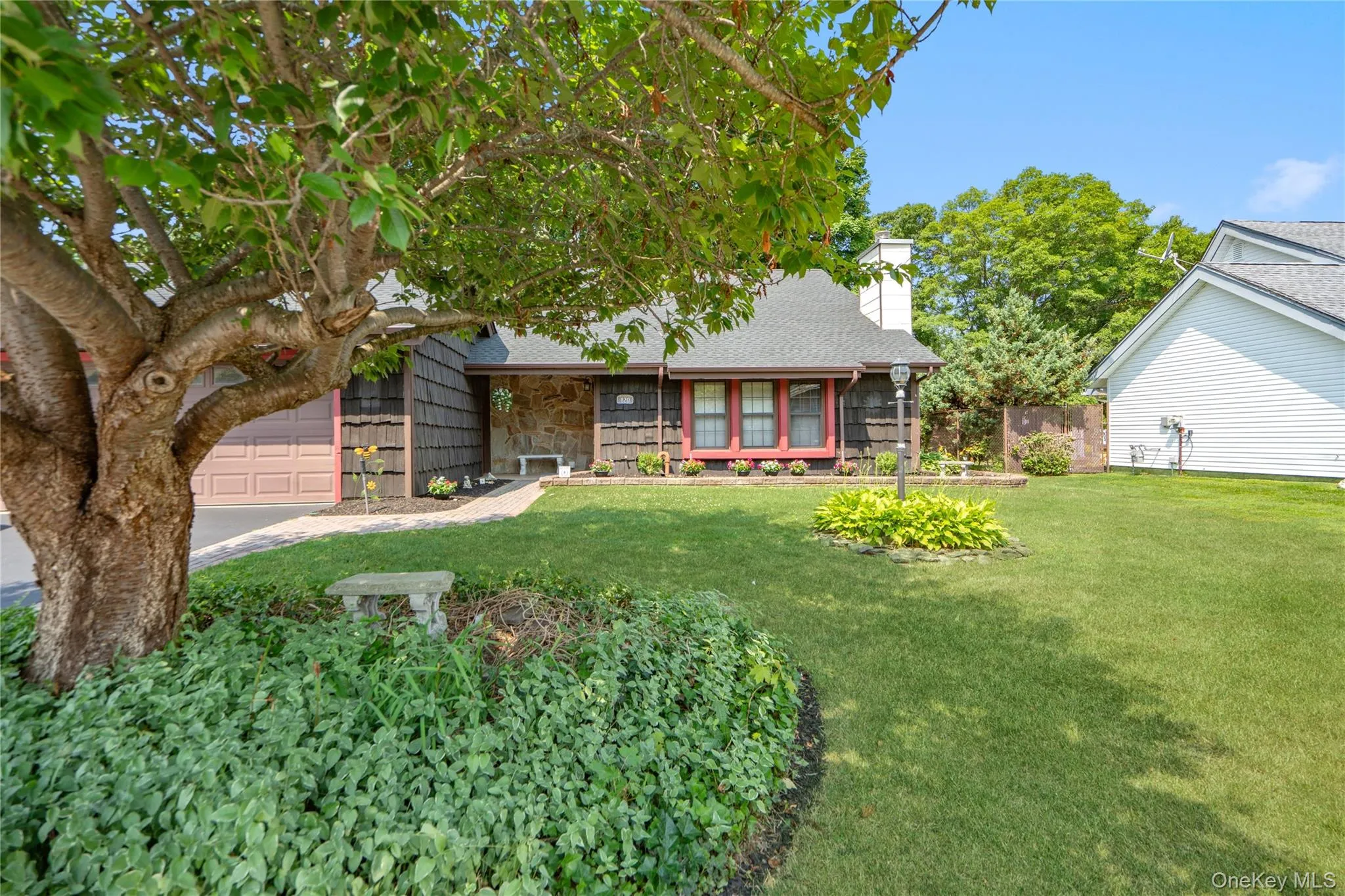 The lush and mature landscaping highlight the front of the home as well. The lush and mature landscaping highlight the front of the home as well.
