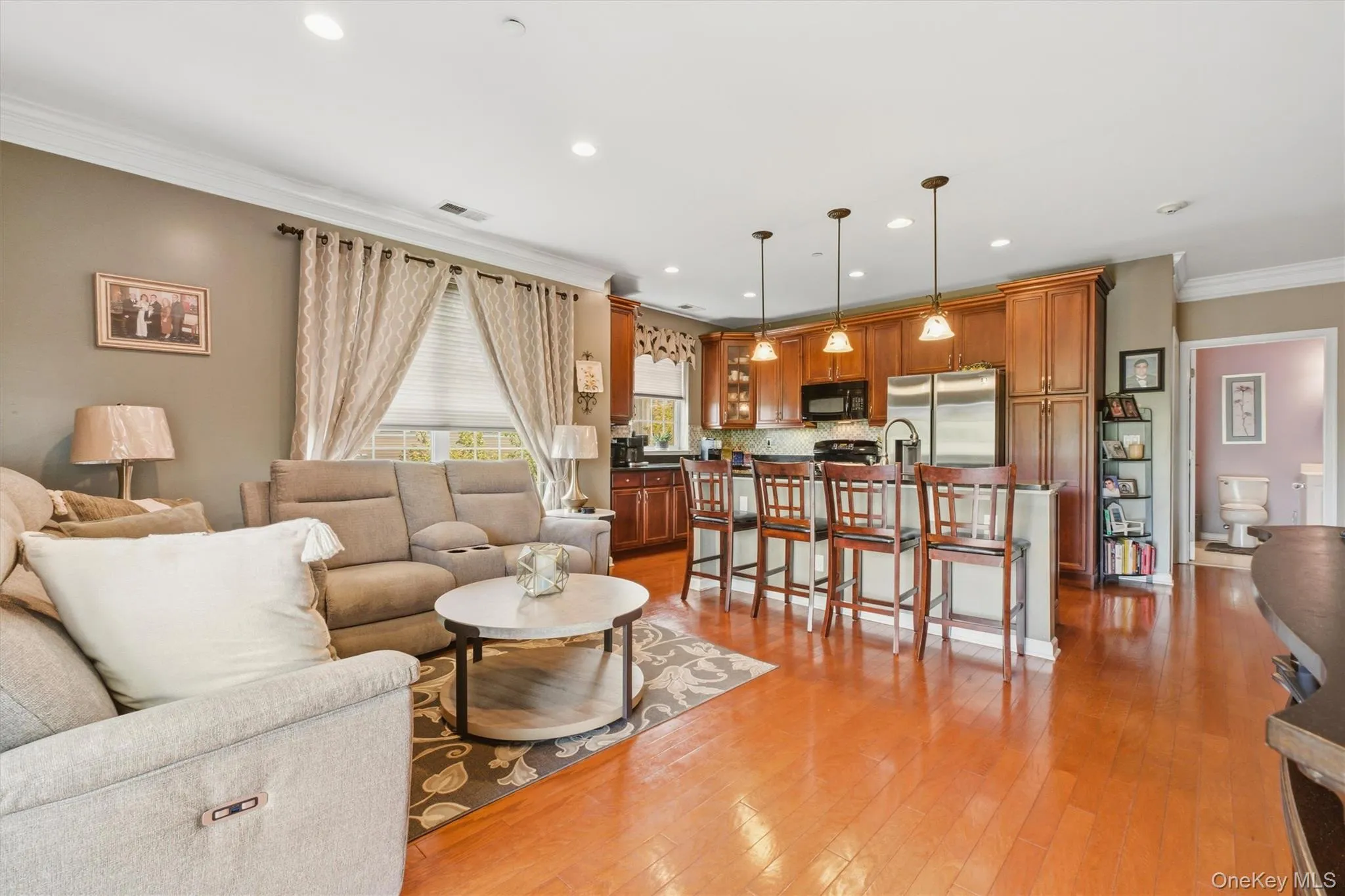 Large sliding glass door floods the area with natural light and offer scenic views, while the open layout flows effortlessly into a cozy family room, open kitchen and dining room layout — ideal for hosting gatherings or enjoying quiet evenings at home. This kitchen balances warmth and sophistication, offering both beauty and top-tier practicality. Large sliding glass door floods the area with natural light and offer scenic views, while the open layout flows effortlessly into a cozy family room, open kitchen and dining room layout — ideal for hosting gatherings or enjoying quiet evenings at home. This kitchen balances warmth and sophistication, offering both beauty and top-tier practicality.