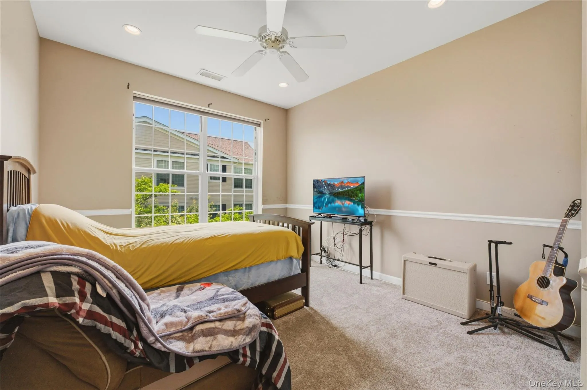 The generous second bedroom offers flexibility as a guest room or home office and provides light and sun filled room. The generous second bedroom offers flexibility as a guest room or home office and provides light and sun filled room.