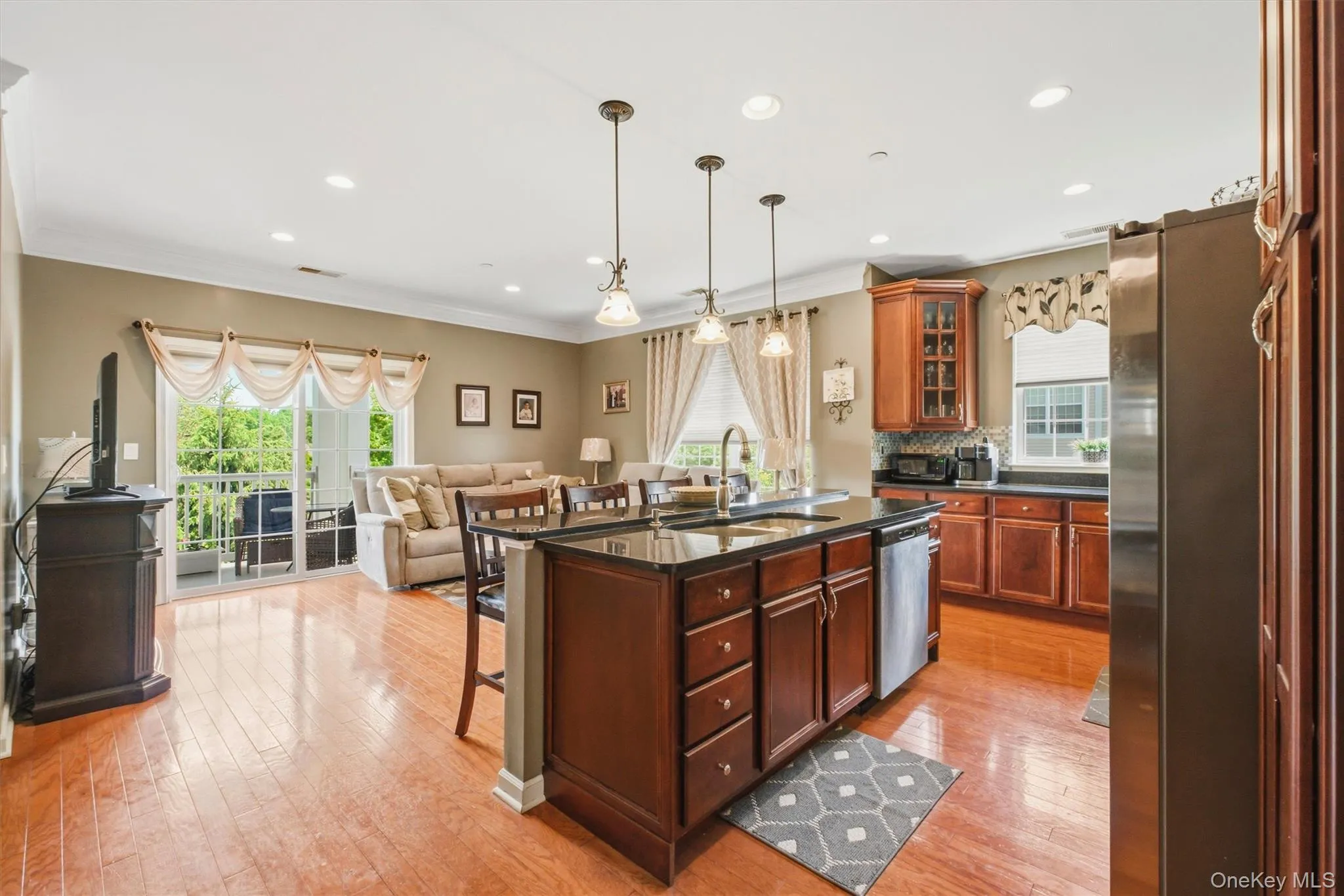 This beautifully maintained home shows like a model and features an open-concept floor plan designed for comfortable living and entertaining. The spacious kitchen boasts granite countertops, stainless steel appliances, and a sunny dining area. The dining room and living room flow seamlessly together, with sliding glass doors leading to the private deck where you can relax and enjoy the tranquil surroundings. This beautifully maintained home shows like a model and features an open-concept floor plan designed for comfortable living and entertaining. The spacious kitchen boasts granite countertops, stainless steel appliances, and a sunny dining area. The dining room and living room flow seamlessly together, with sliding glass doors leading to the private deck where you can relax and enjoy the tranquil surroundings.
