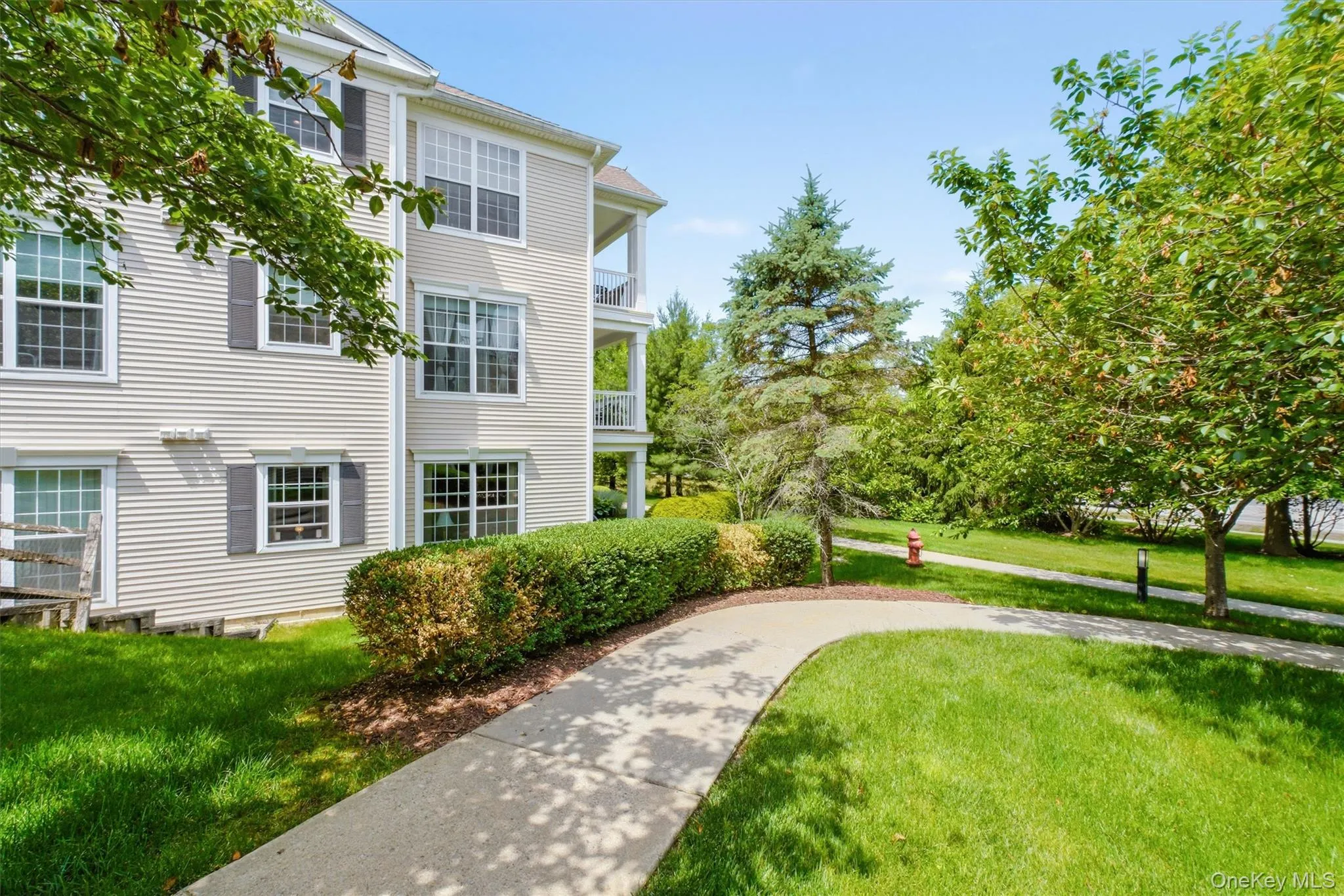 Enjoy unmatched privacy from your spacious rear deck, overlooking a park-like green space between building sections that creates a peaceful, secluded setting rarely found in condominium living. Enjoy unmatched privacy from your spacious rear deck, overlooking a park-like green space between building sections that creates a peaceful, secluded setting rarely found in condominium living.