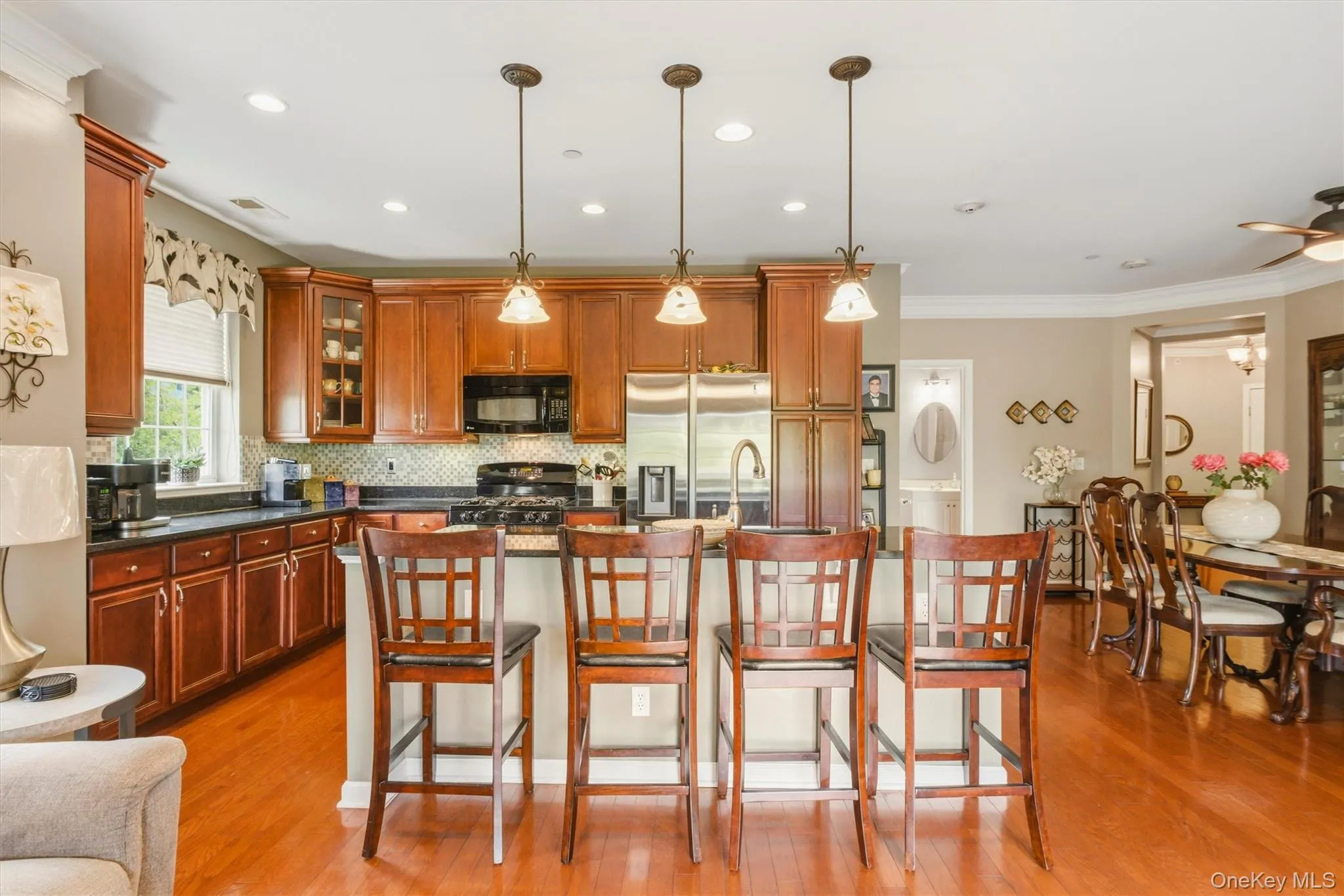 With an open layout that flows effortlessly from the Family room to the kitchen and dining area, and finished with hardwood floors and elegant details, this space is an entertainer’s dream — both stylish and functional. With an open layout that flows effortlessly from the Family room to the kitchen and dining area, and finished with hardwood floors and elegant details, this space is an entertainer’s dream — both stylish and functional.