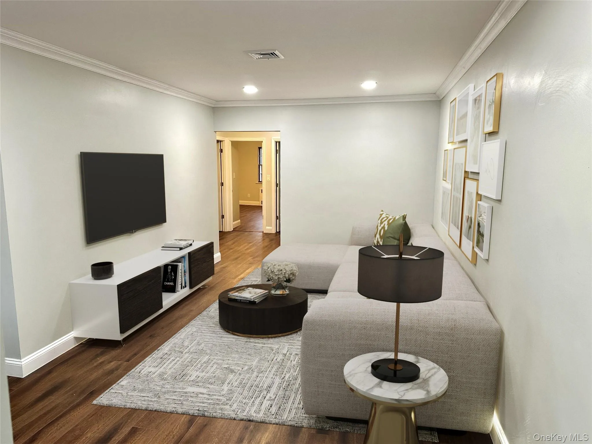 Living area featuring wood-finish flooring, recessed lighting, and crown molding Living area featuring wood-finish flooring, recessed lighting, and crown molding