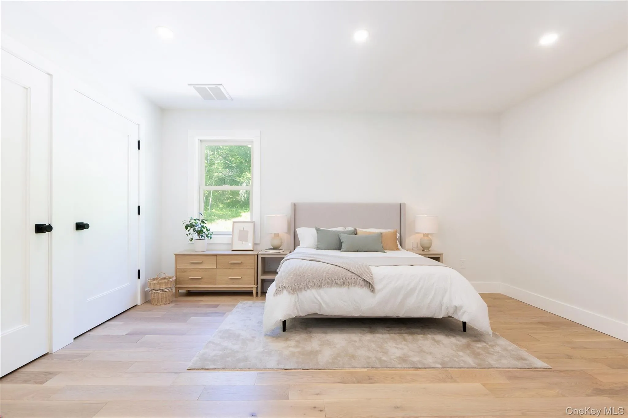 Bright room featuring light wood-finish flooring, recessed lighting, and a double-hung windowImages have been virtually staged to illustrate the property's potential Bright room featuring light wood-finish flooring, recessed lighting, and a double-hung windowImages have been virtually staged to illustrate the property's potential