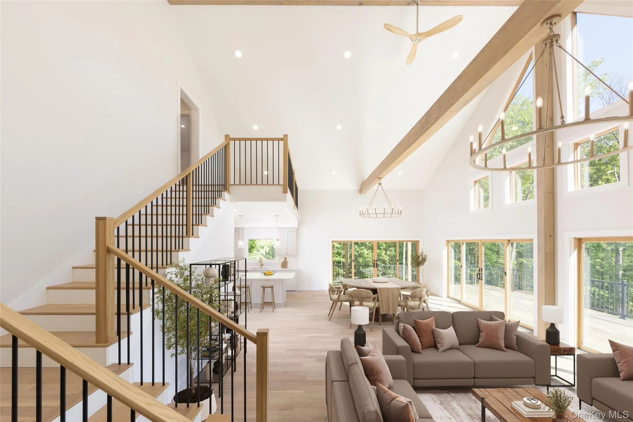 Bright open-concept living space with a vaulted ceiling and exposed wood beamsImages have been virtually staged to illustrate the property's potential Bright open-concept living space with a vaulted ceiling and exposed wood beamsImages have been virtually staged to illustrate the property's potential