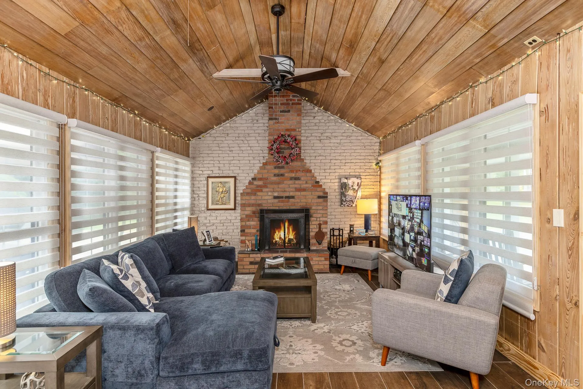 Den with wood burning fireplace Den with wood burning fireplace