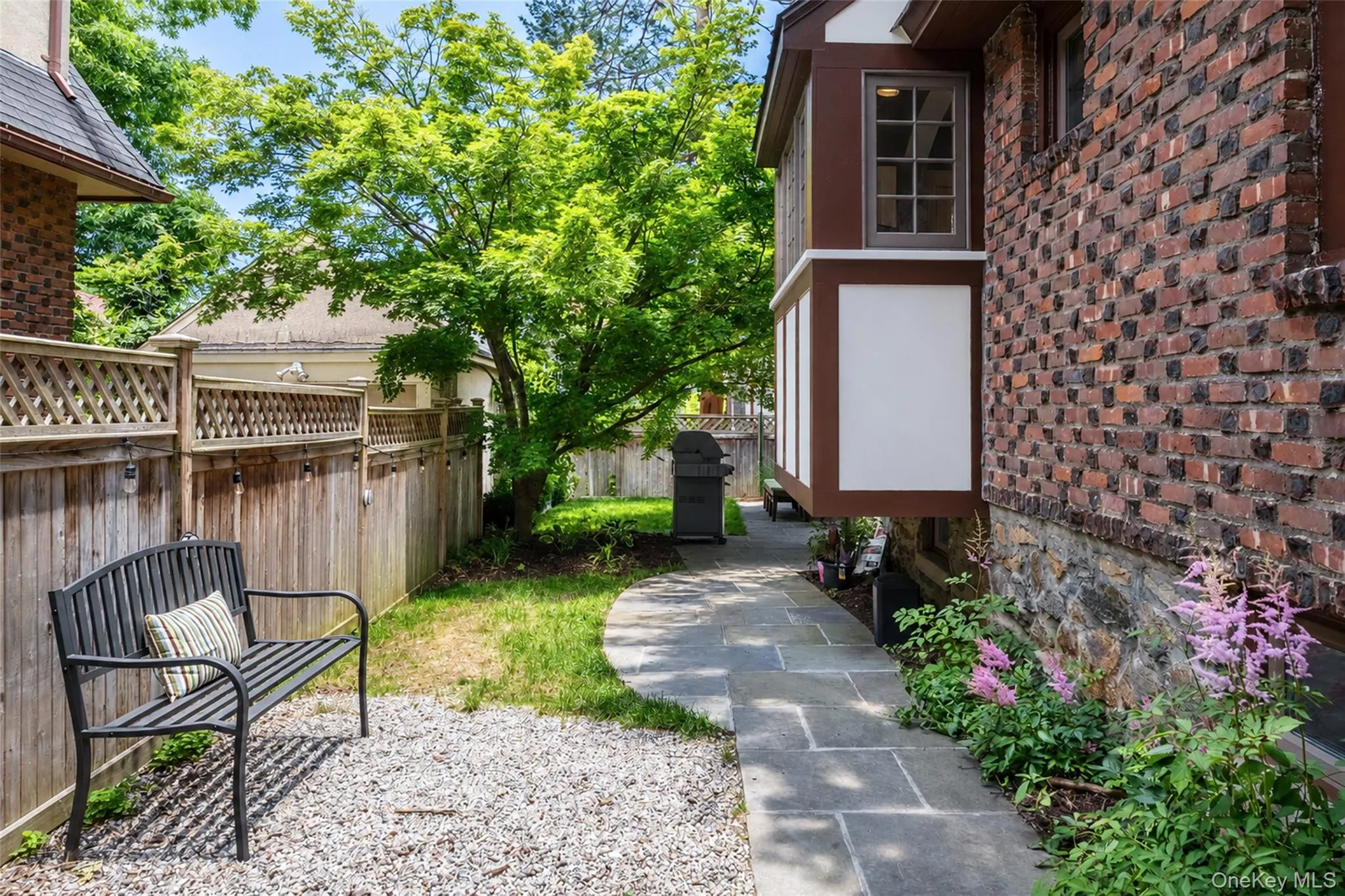 Side yard on left of the home Side yard on left of the home