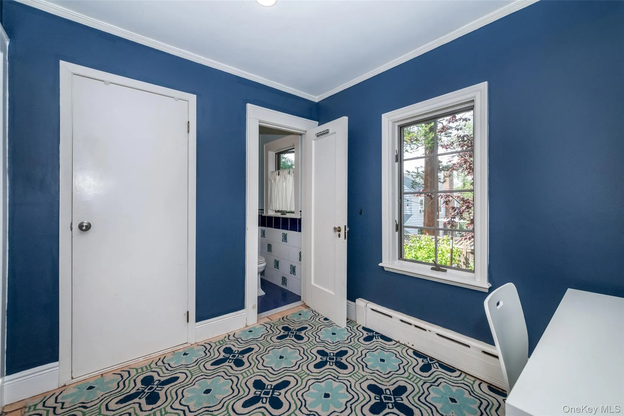 View of room featuring large pantry closet and powder room View of room featuring large pantry closet and powder room