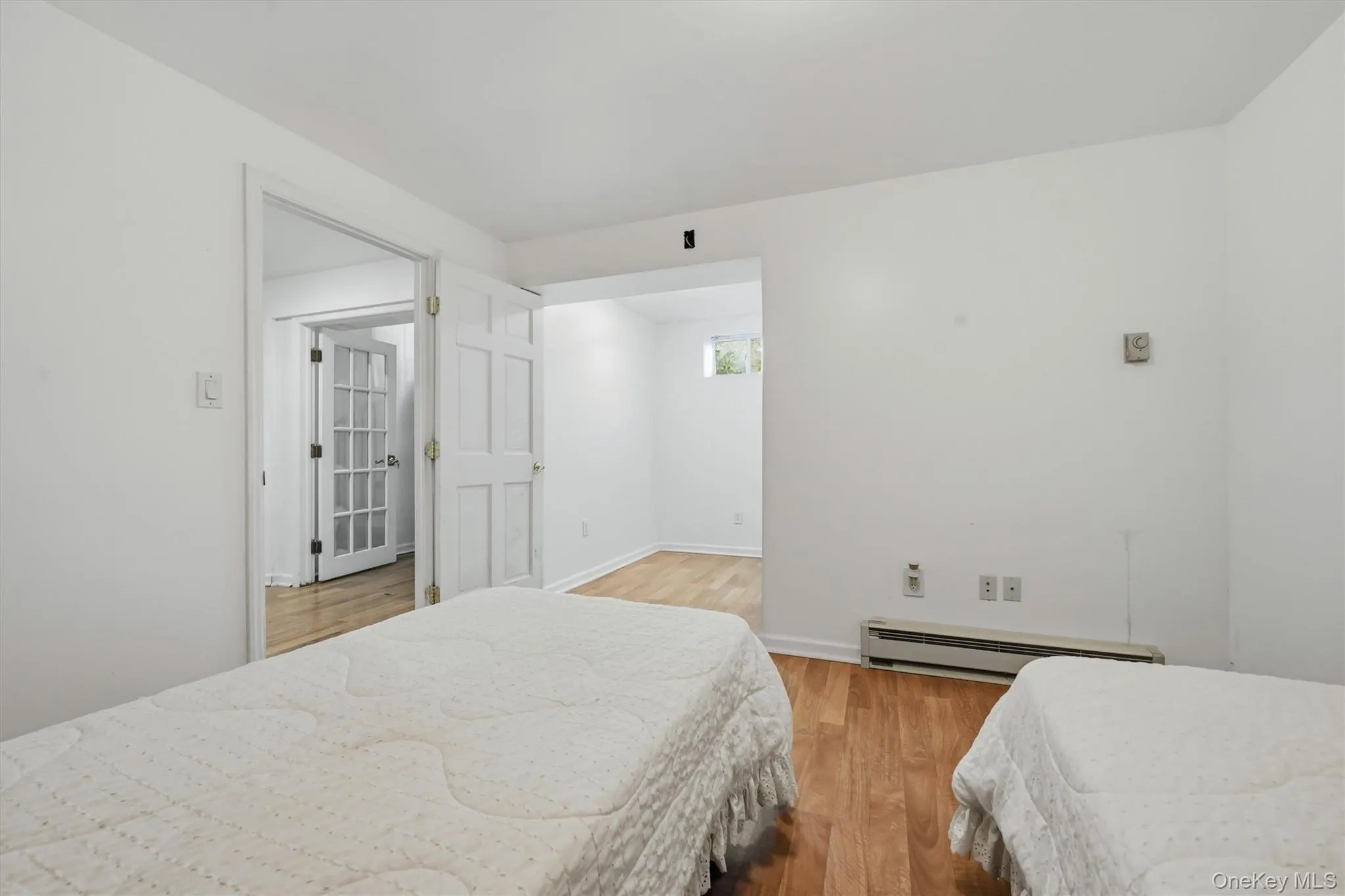 Lower-Level In-Law Suite Bedroom with Walk-In Closet Lower-Level In-Law Suite Bedroom with Walk-In Closet