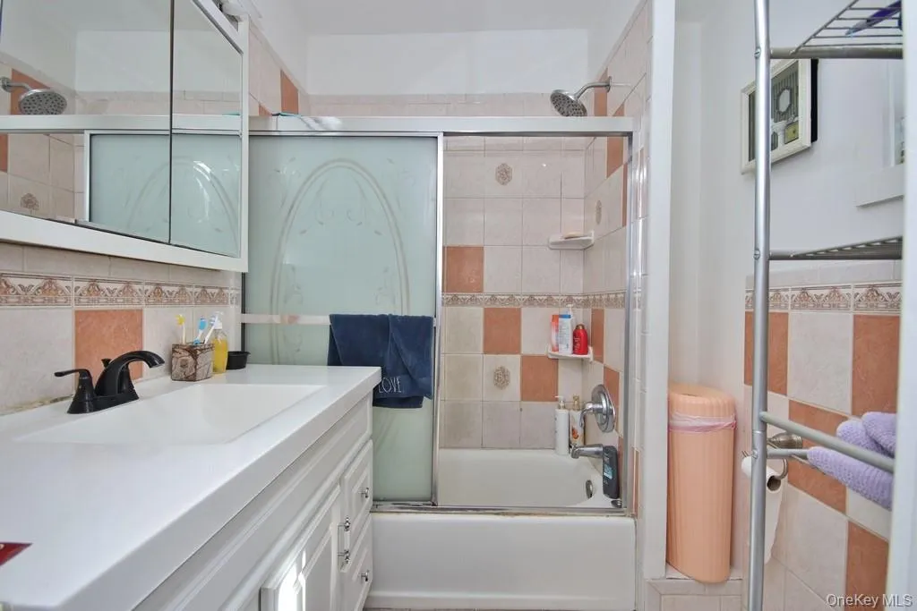 Full Bath featuring a bathtub with shower Full Bath featuring a bathtub with shower