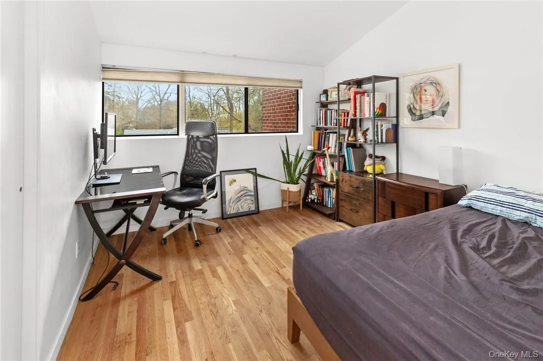 Bright and spacious second bedroom with large windows, hardwood floors, and ample space for both relaxation and work. Bright and spacious second bedroom with large windows, hardwood floors, and ample space for both relaxation and work.