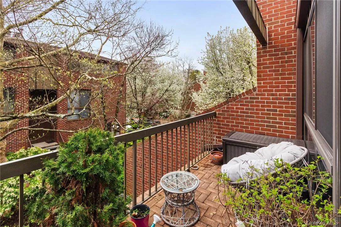Private first-floor balcony with lush views, perfect for enjoying morning coffee or relaxing outdoors. Private first-floor balcony with lush views, perfect for enjoying morning coffee or relaxing outdoors.
