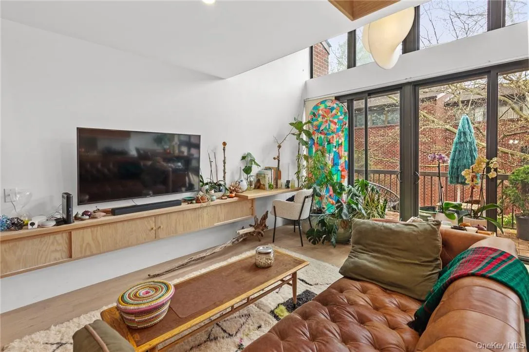 Bright and airy living space with access to a private balcony, perfect for relaxation and entertaining. Bright and airy living space with access to a private balcony, perfect for relaxation and entertaining.