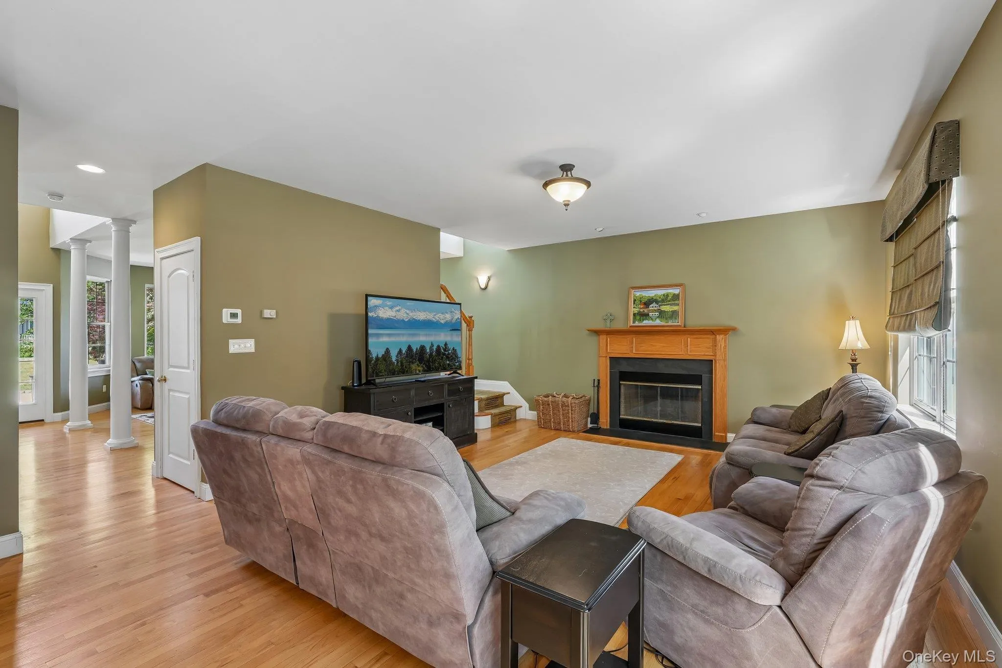 Family room with gleaming hardwood floors. Family room with gleaming hardwood floors.