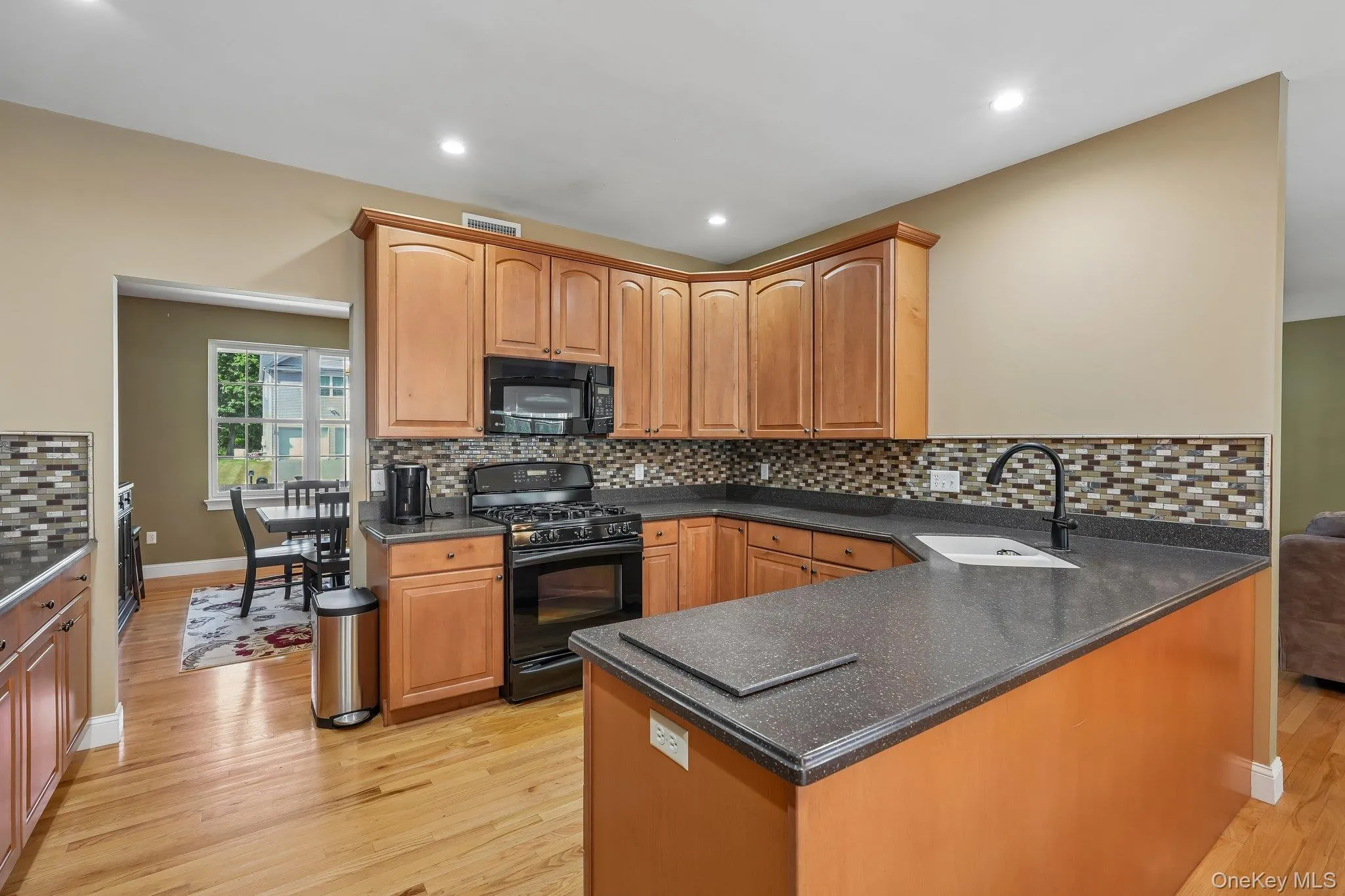 Efficient style kitchen with corian ocunter tops and maple cabinets. Efficient style kitchen with corian ocunter tops and maple cabinets.