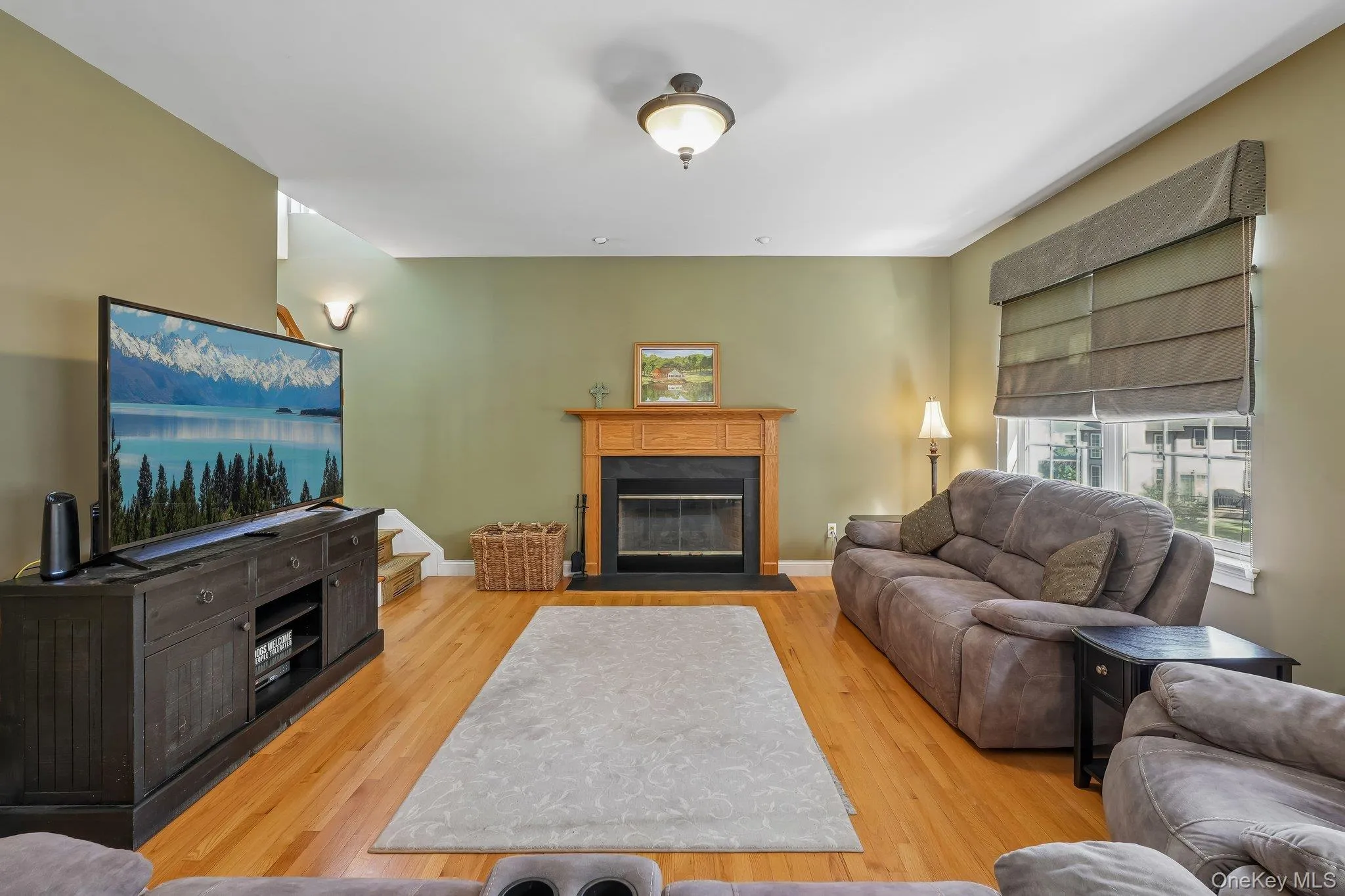 Family room with hardwood floors and fireplace. Family room with hardwood floors and fireplace.