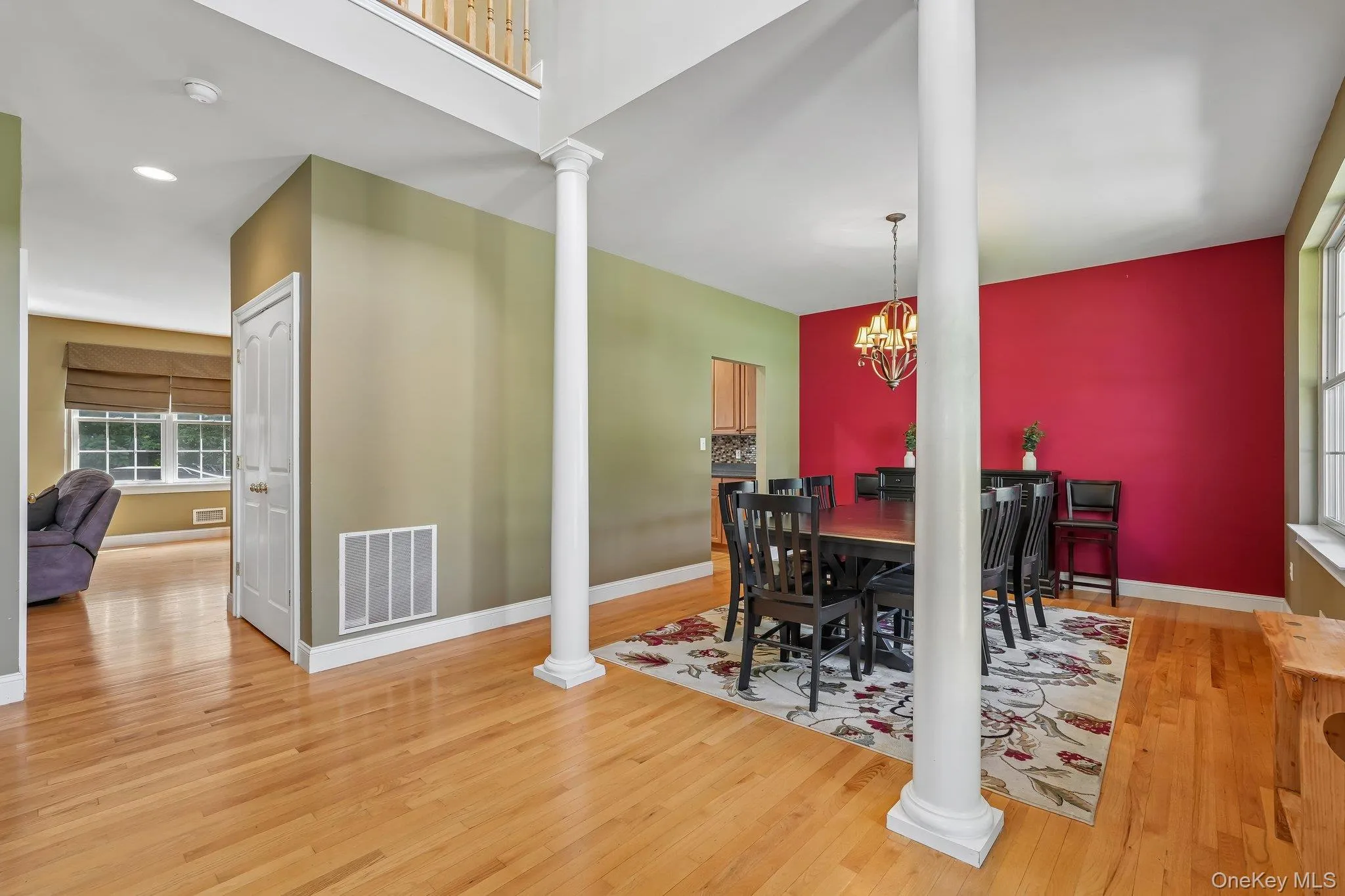 Formal Dining Room with hardwood floors and decorative columns. Formal Dining Room with hardwood floors and decorative columns.
