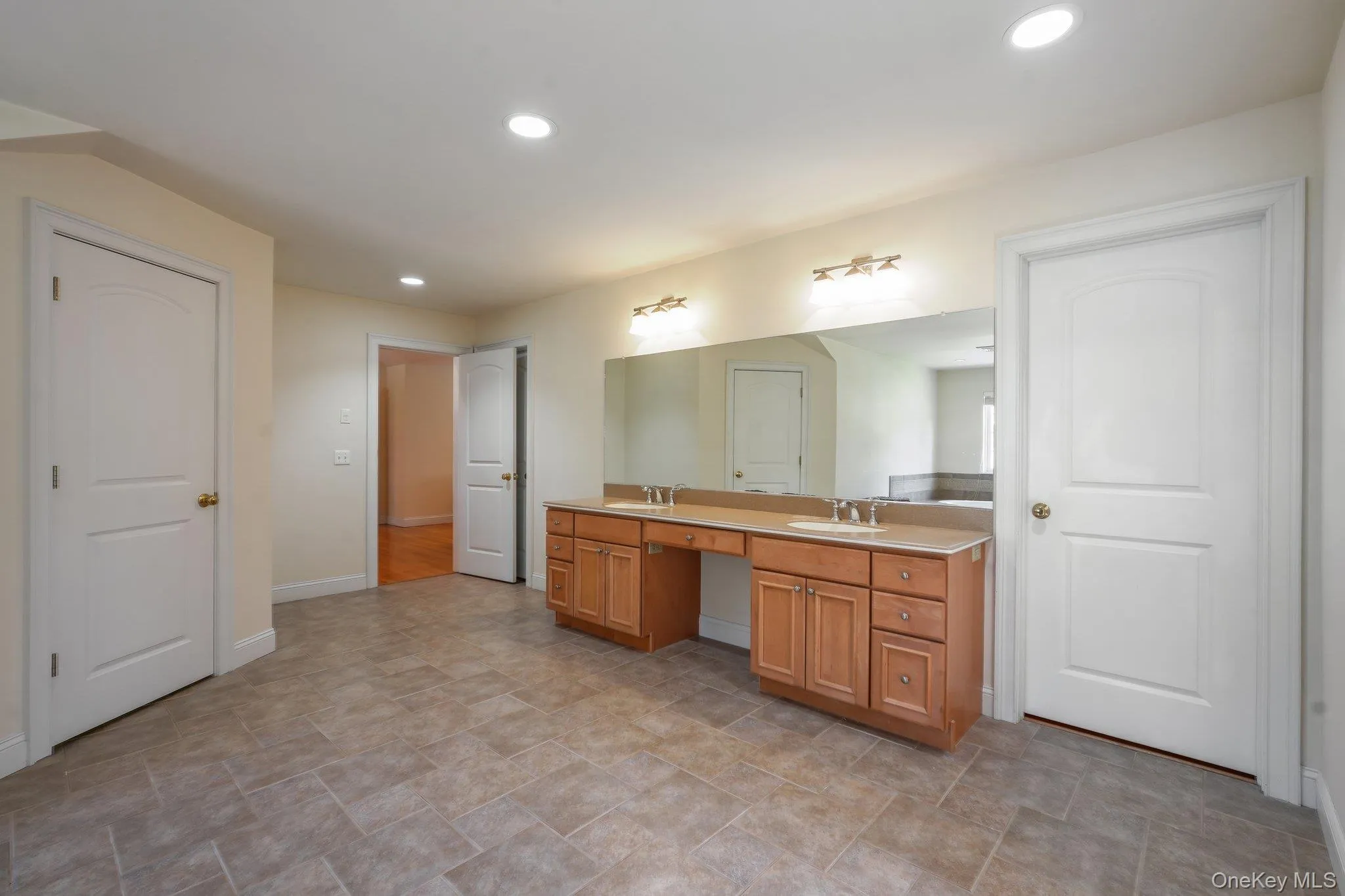 Primary bathroom with dual sinks, whirlpool tub and separate shower. Primary bathroom with dual sinks, whirlpool tub and separate shower.