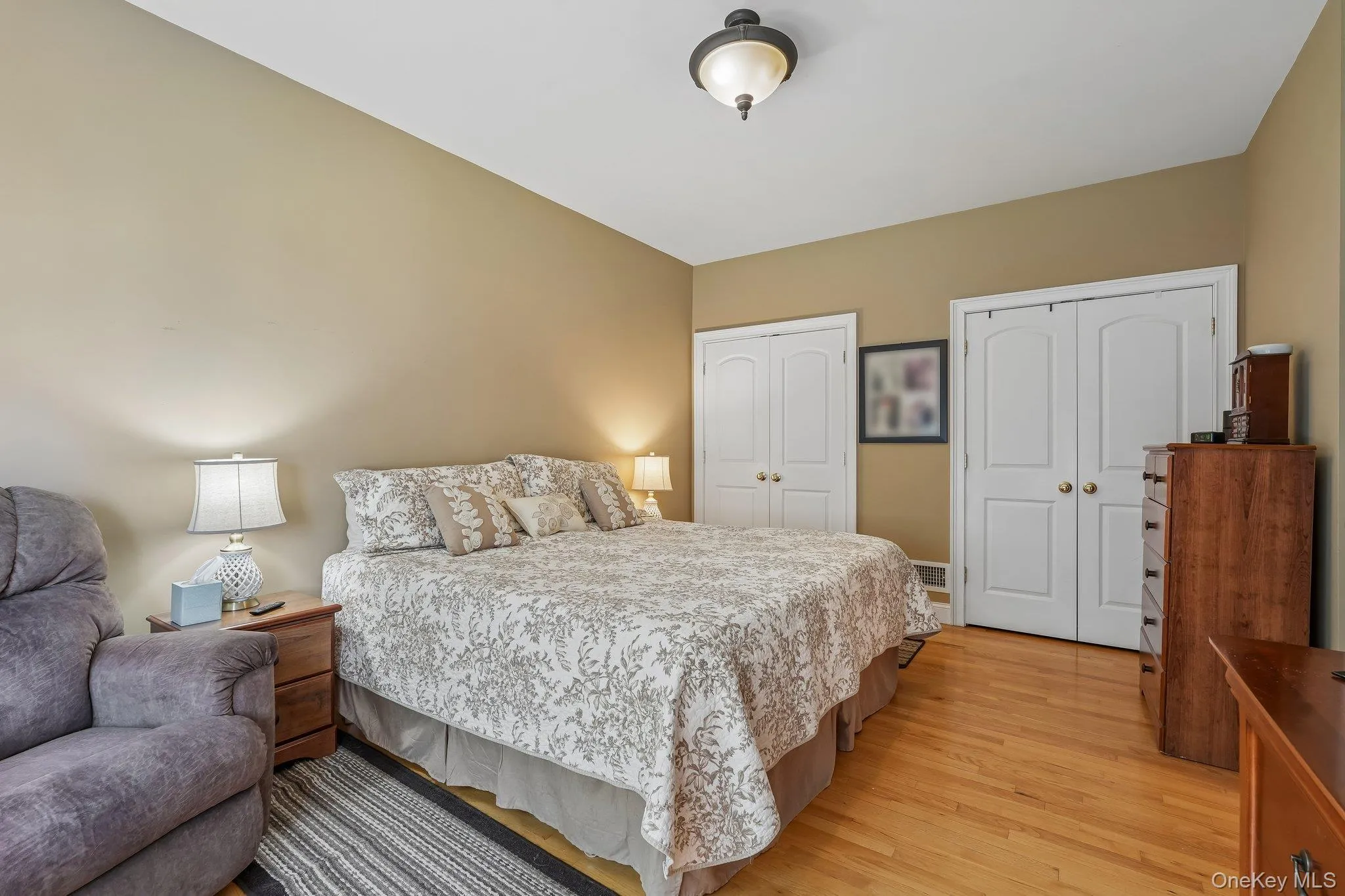 First Floor bedroom with hardwood floors and two wall closets. First Floor bedroom with hardwood floors and two wall closets.