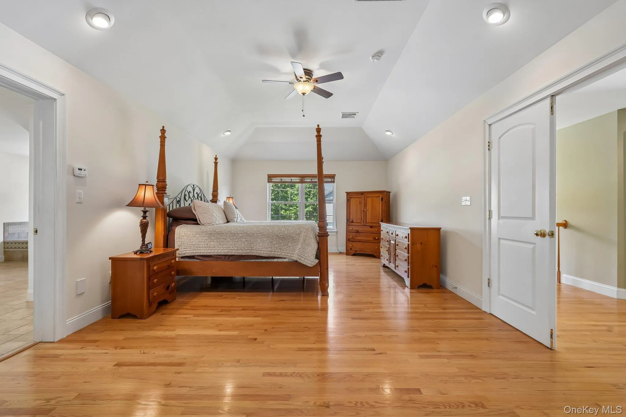 Huge primary bedroom with hardwood floors. Huge primary bedroom with hardwood floors.