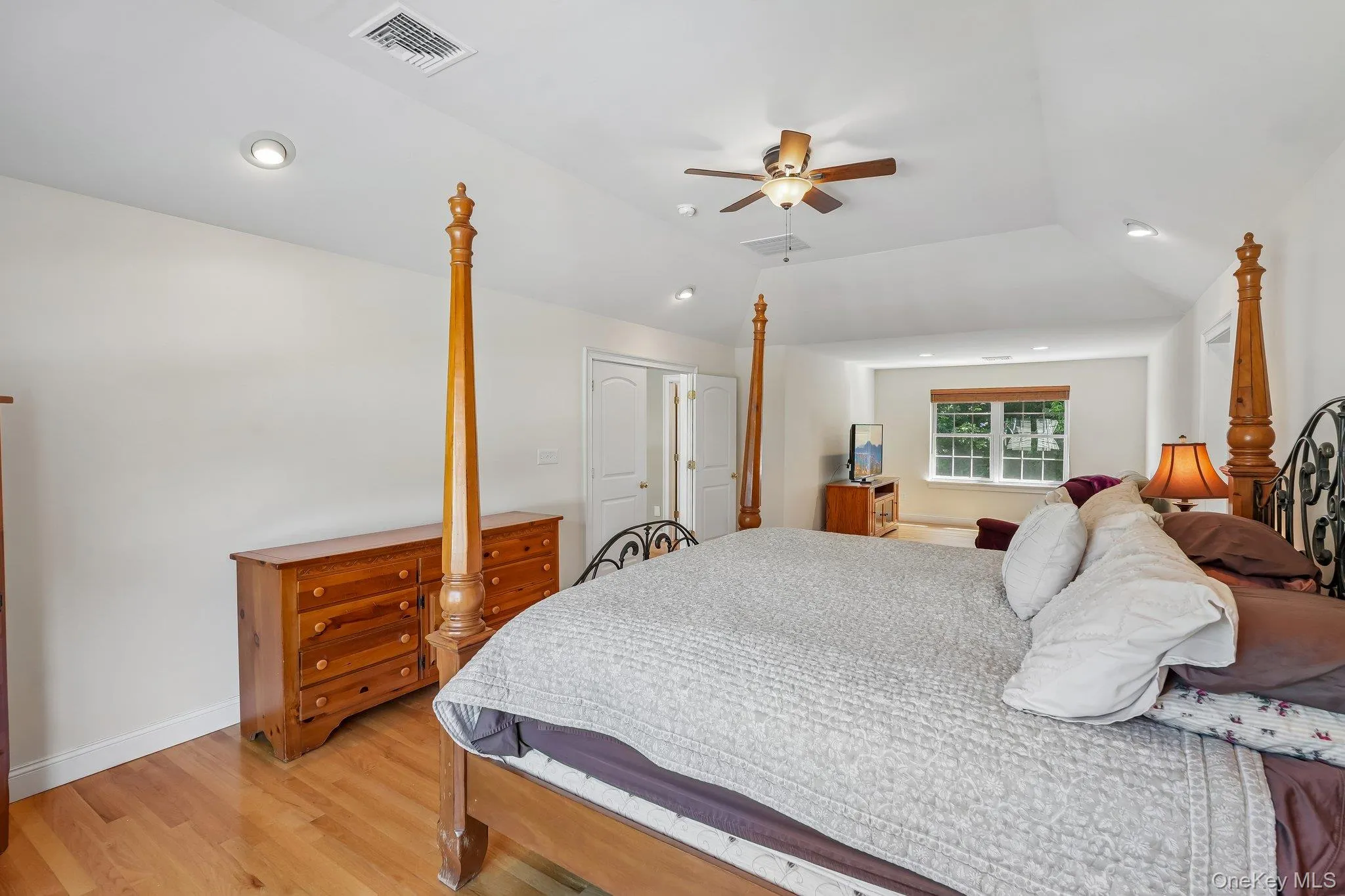 Huge primary bedroom with hardwood floors. Huge primary bedroom with hardwood floors.