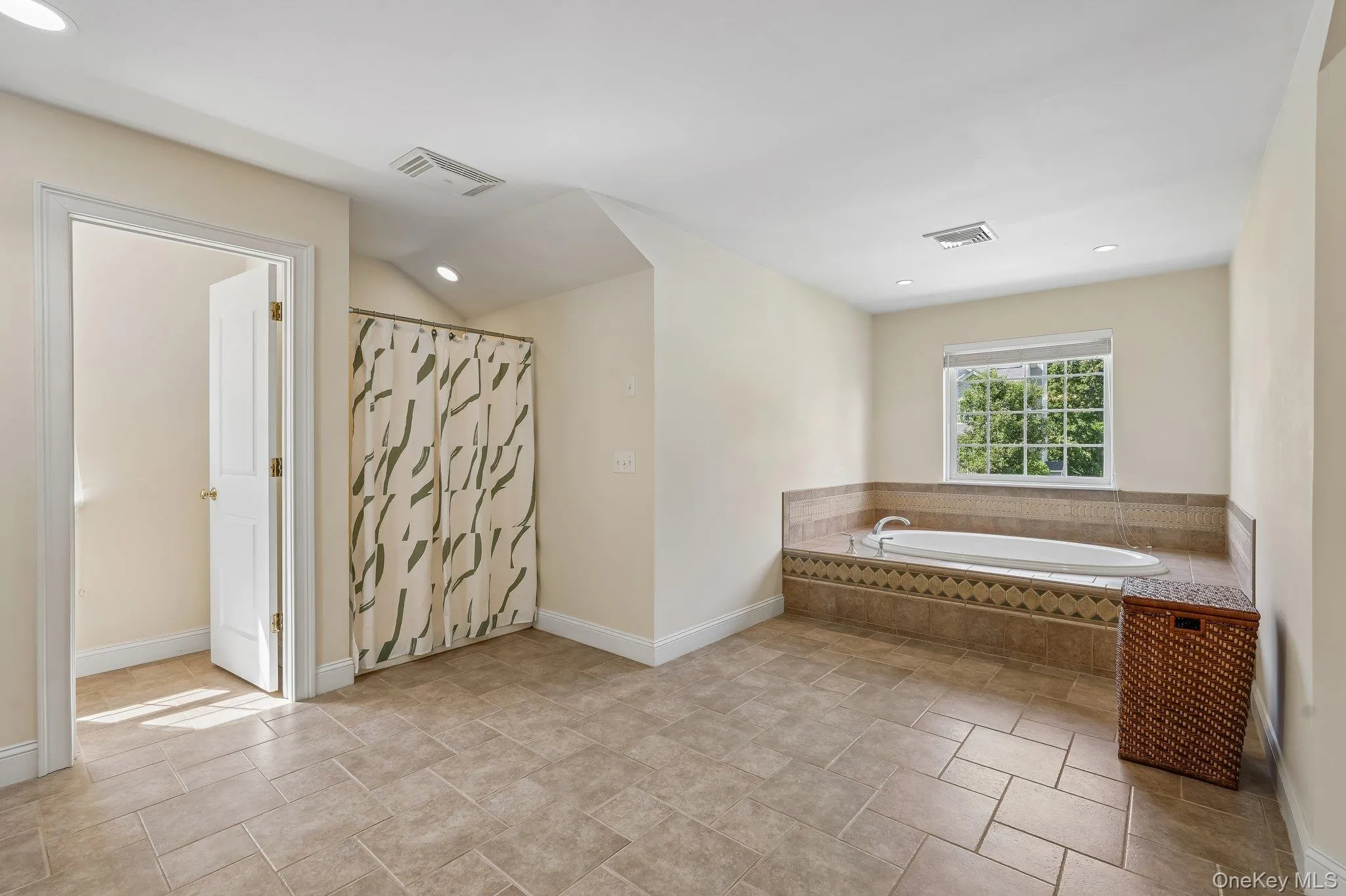 Primary bathroom with dual sinks, whirlpool tub and separate shower. Primary bathroom with dual sinks, whirlpool tub and separate shower.