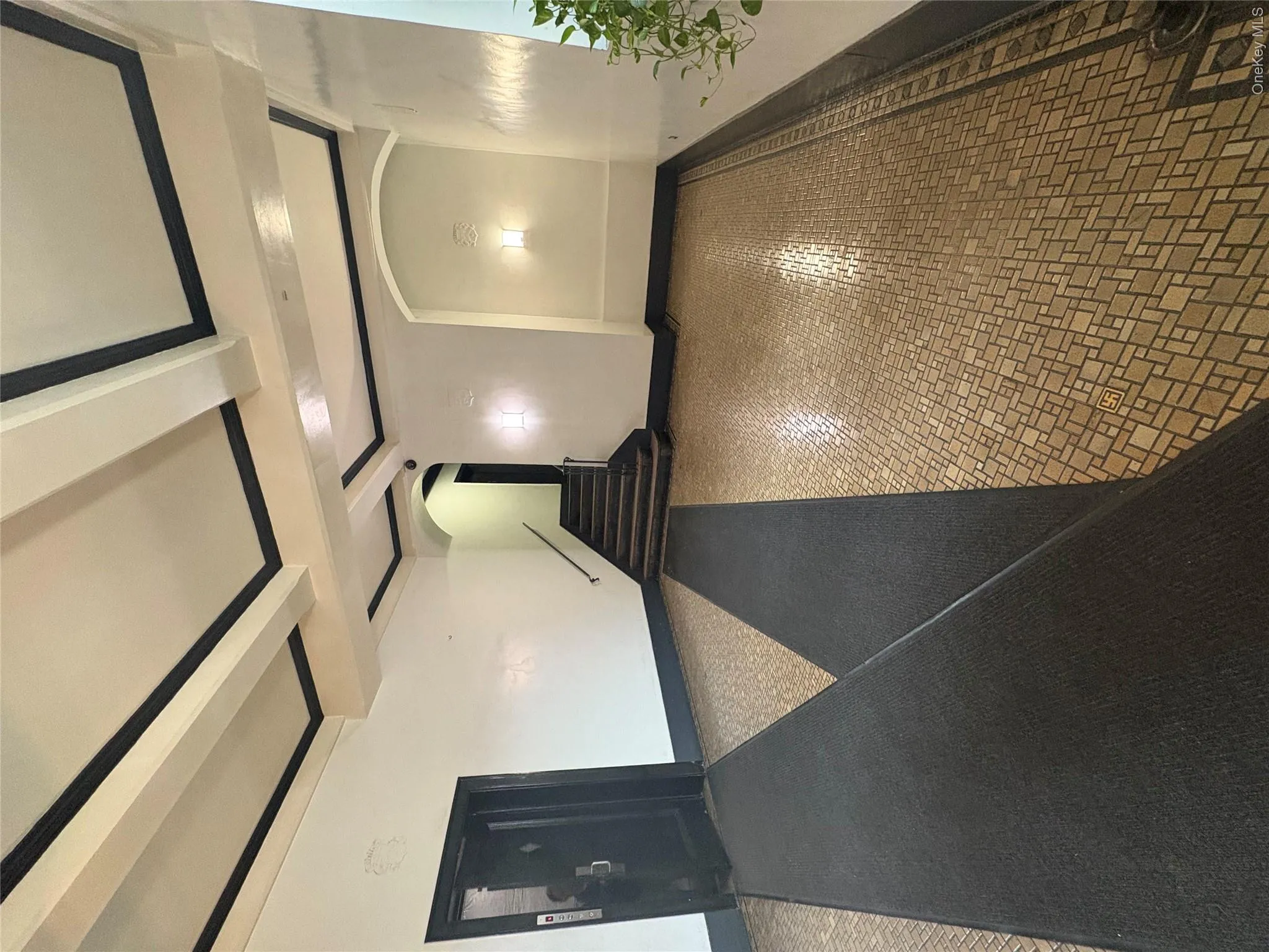 Hallway with beam ceiling and arched walkways Hallway with beam ceiling and arched walkways