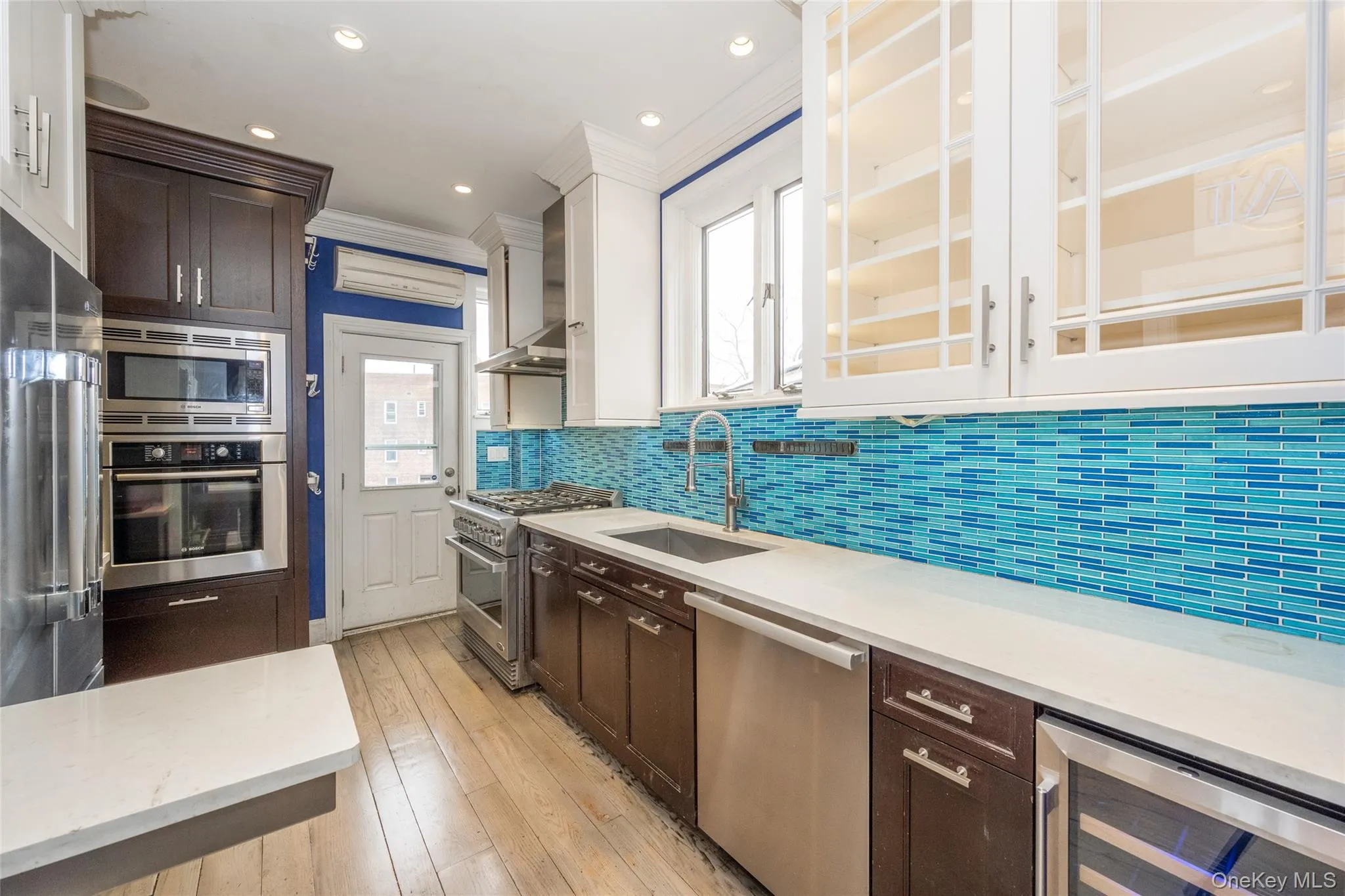 Contemporary kitchen featuring a vibrant blue mosaic tile backsplash Contemporary kitchen featuring a vibrant blue mosaic tile backsplash