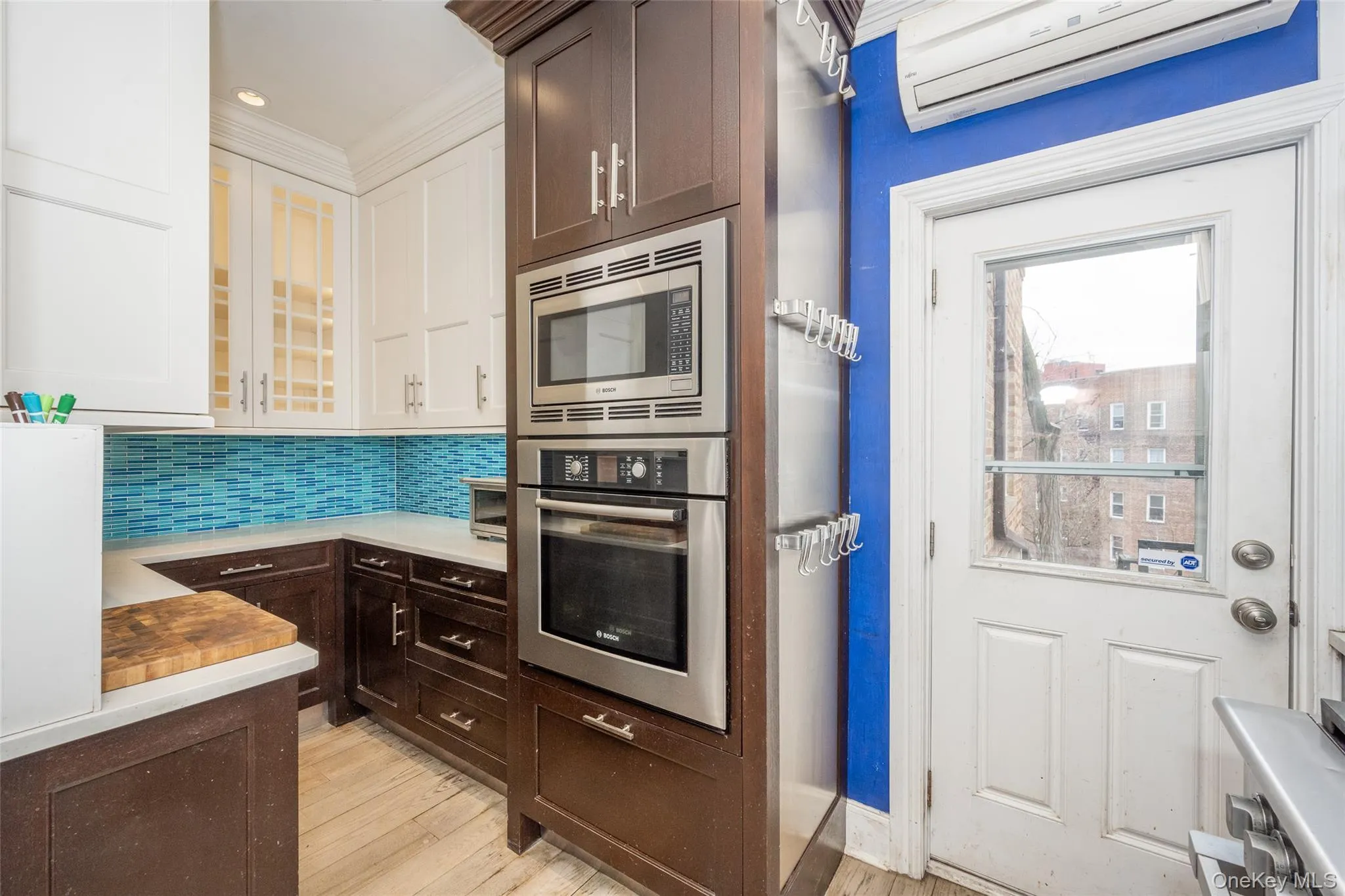 Kitchen with Bosch oven and backdoor leads to private parking. Kitchen with Bosch oven and backdoor leads to private parking.