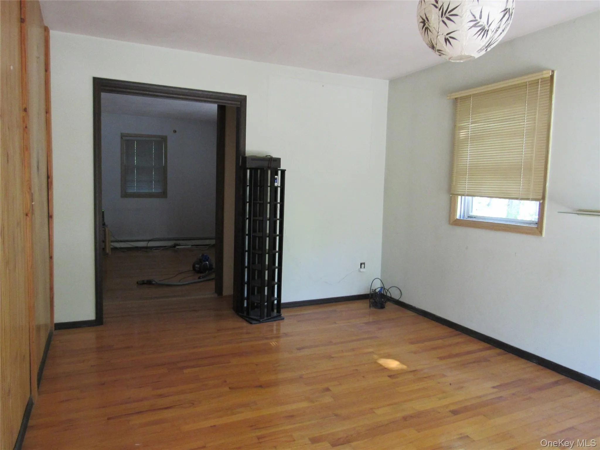 Bedroom with sliders to large deck overlooking backyard Bedroom with sliders to large deck overlooking backyard