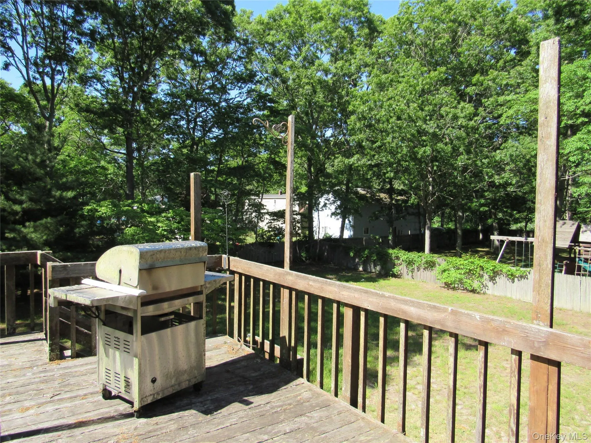 Second floor deck looking over rear yard. Access through bedroom sliding door. Second floor deck looking over rear yard. Access through bedroom sliding door.