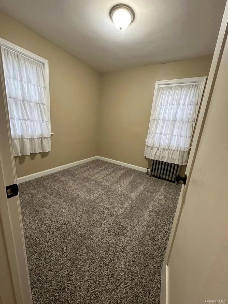 Neutral-toned walls complement the textured gray carpeting Neutral-toned walls complement the textured gray carpeting