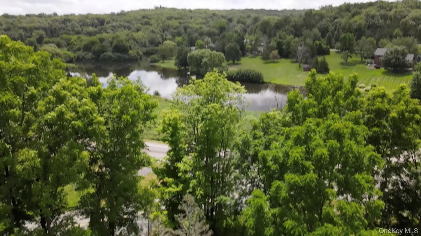 Aerial view of lot with a large pond across the road Aerial view of lot with a large pond across the road