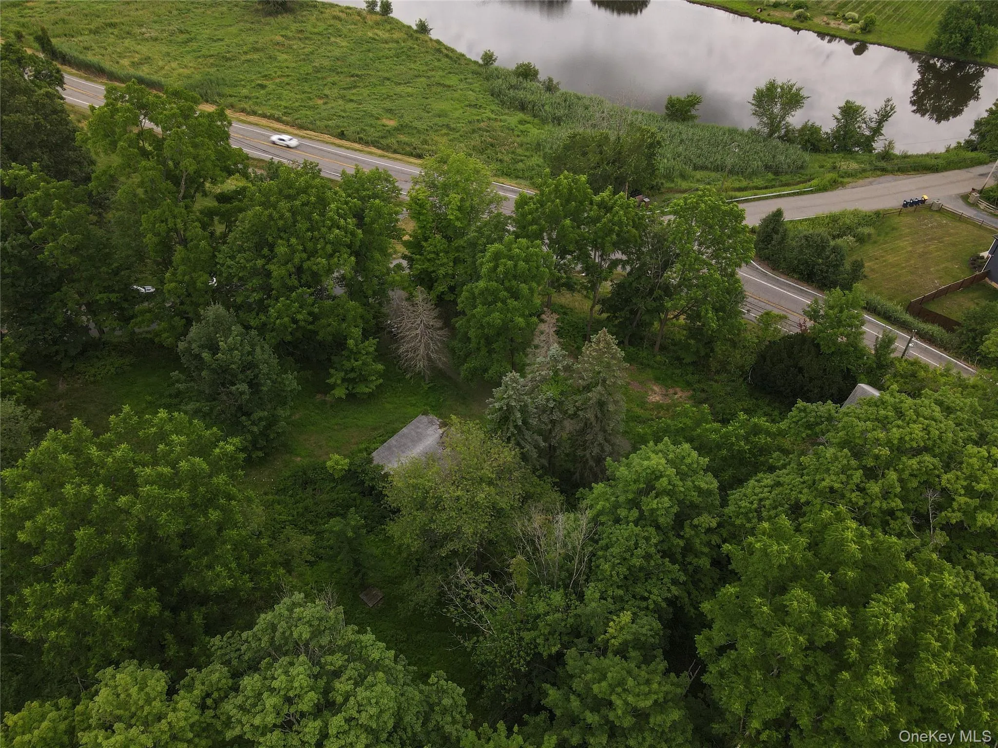 Aerial view of property's location featuring a nearby body of water Aerial view of property's location featuring a nearby body of water