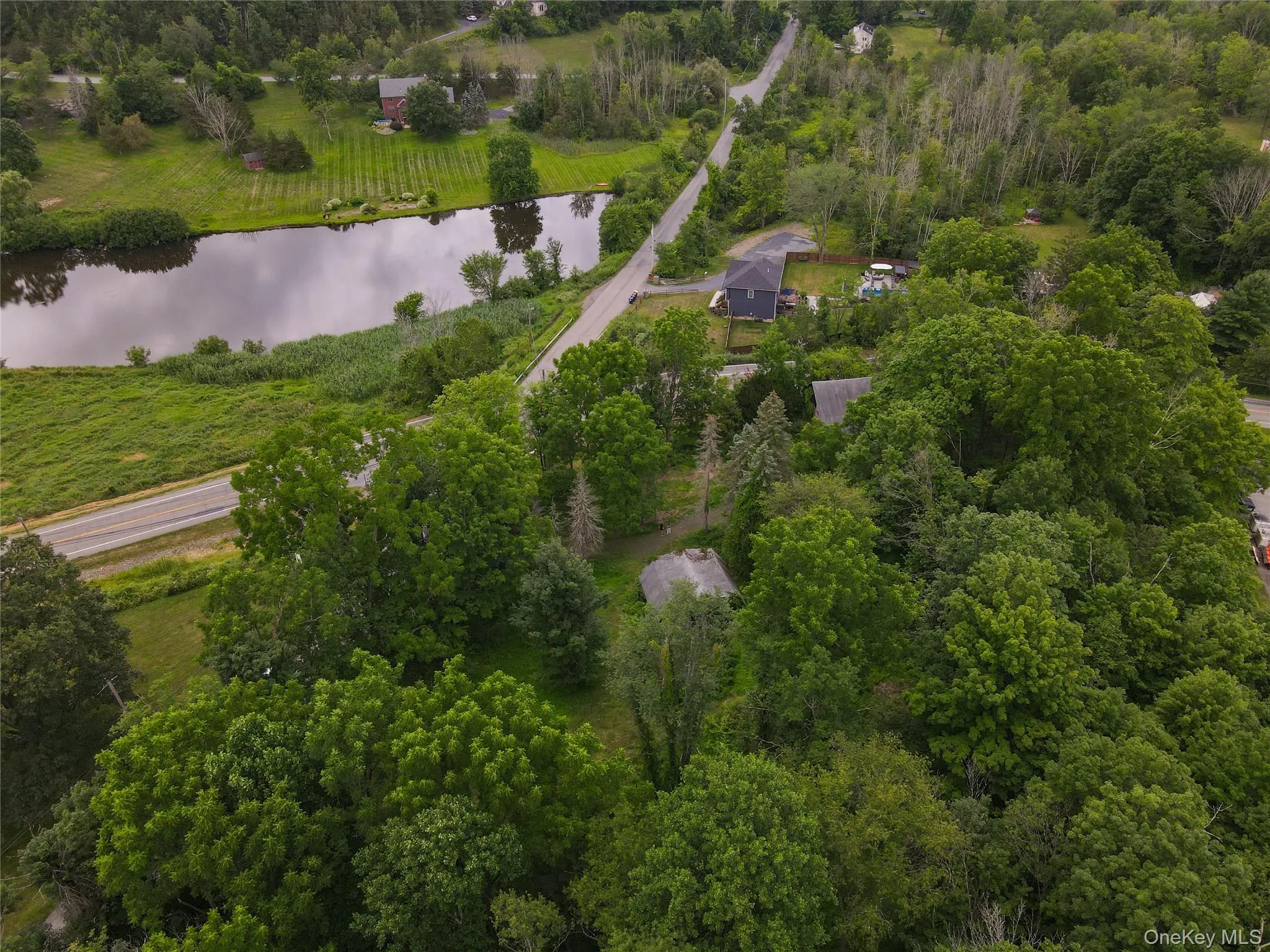 Bird's eye view of the lot and nearby body of water Bird's eye view of the lot and nearby body of water
