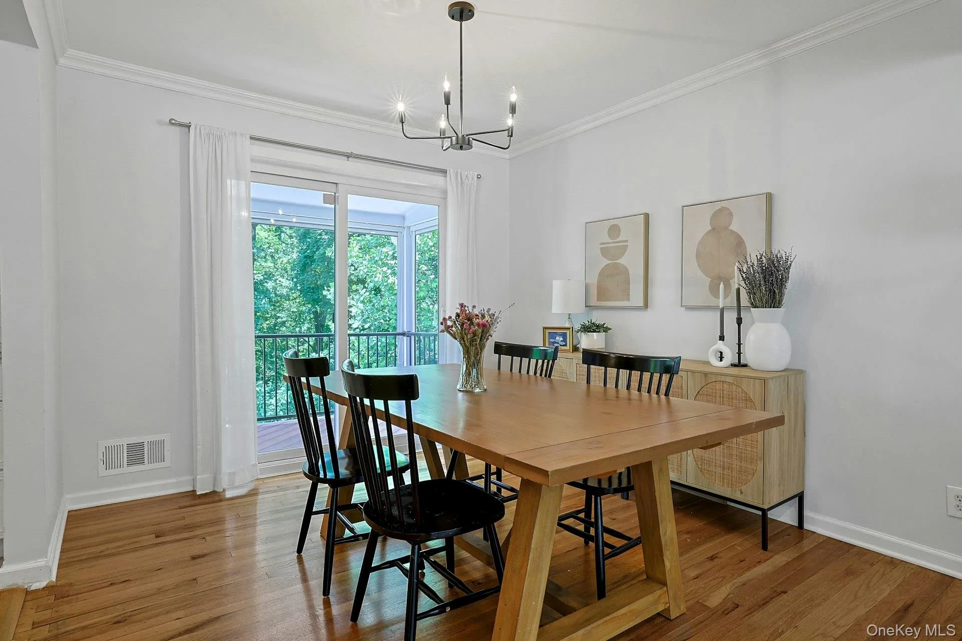 Dining Room with sliding glass door to the screened-in deck. Dining Room with sliding glass door to the screened-in deck.