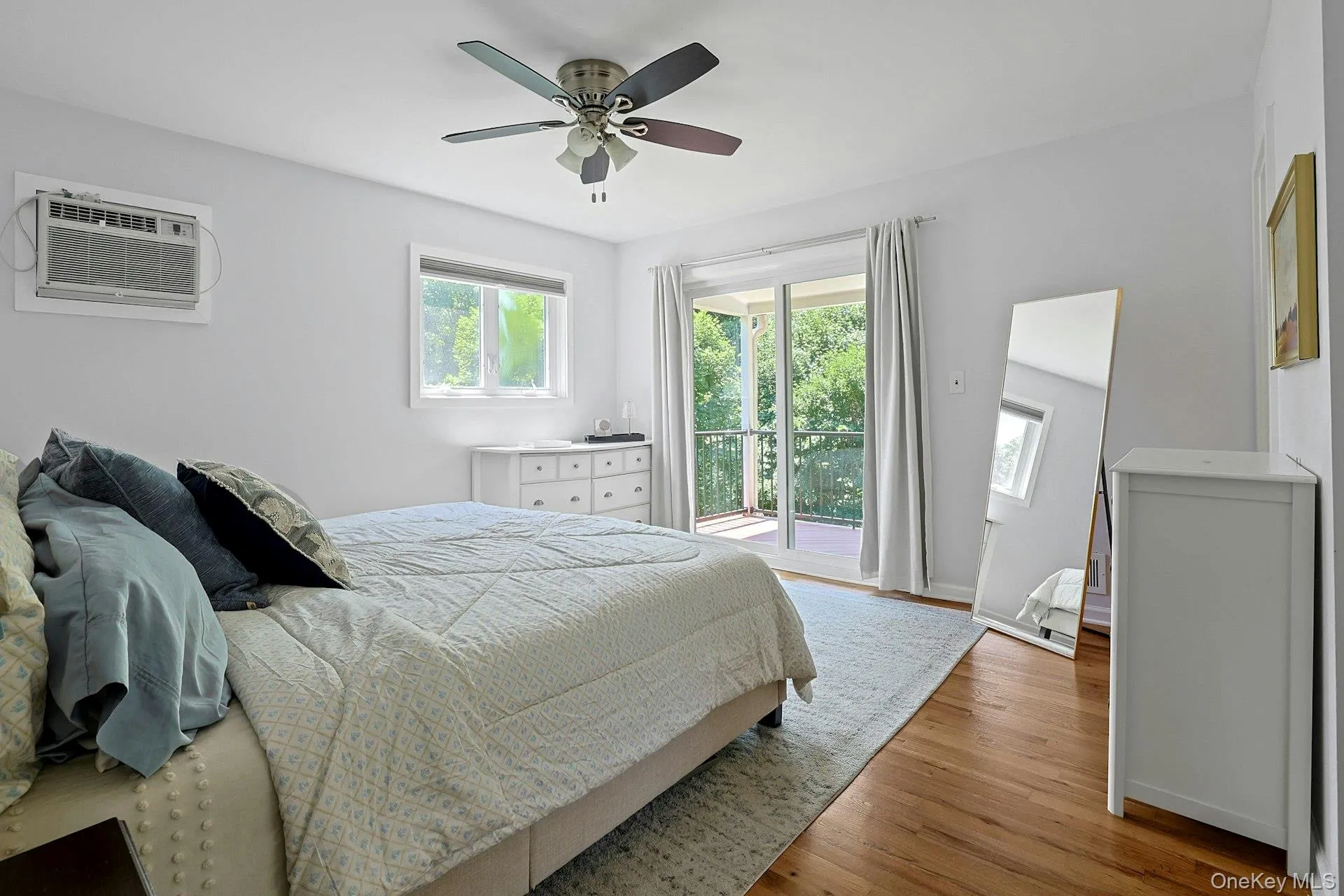 Another angle of the primary bedroom. Please notice the sliding glass doors to a screened-in deck. Another angle of the primary bedroom. Please notice the sliding glass doors to a screened-in deck.