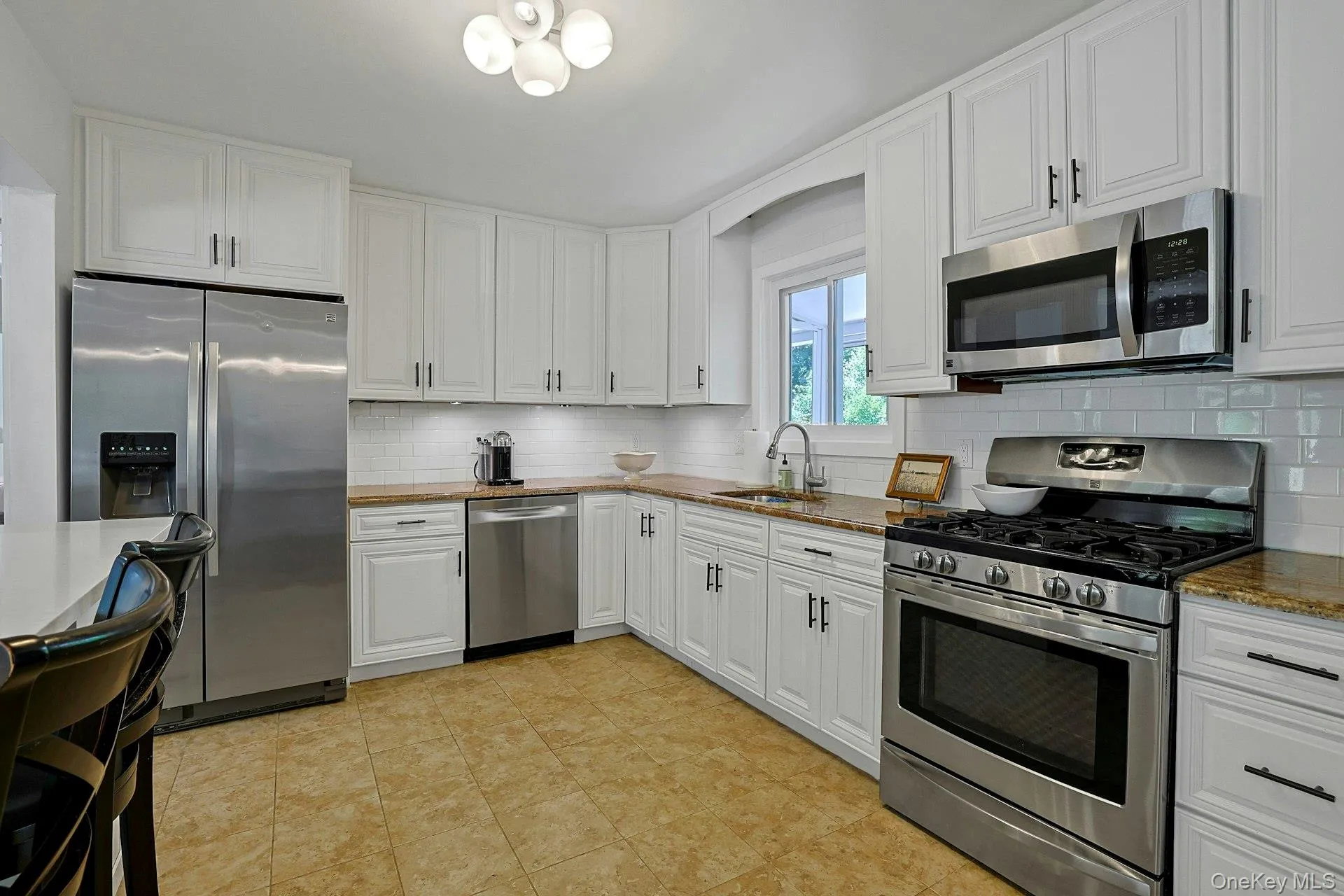The kitchen has granite countertops and stainless steel appliances. The kitchen has granite countertops and stainless steel appliances.