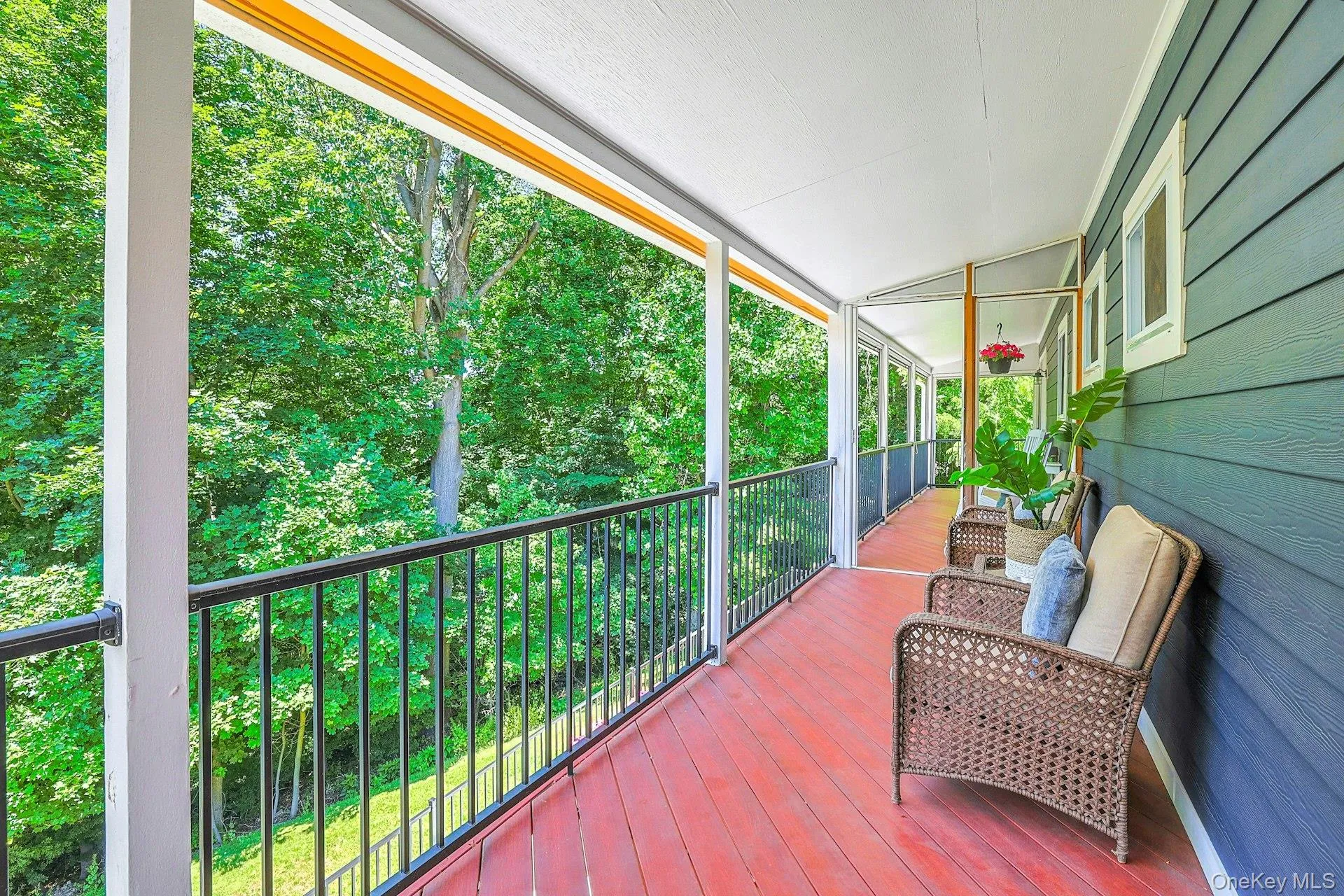 Screened-in deck with sliding glass door taken from the primary bedroom Screened-in deck with sliding glass door taken from the primary bedroom