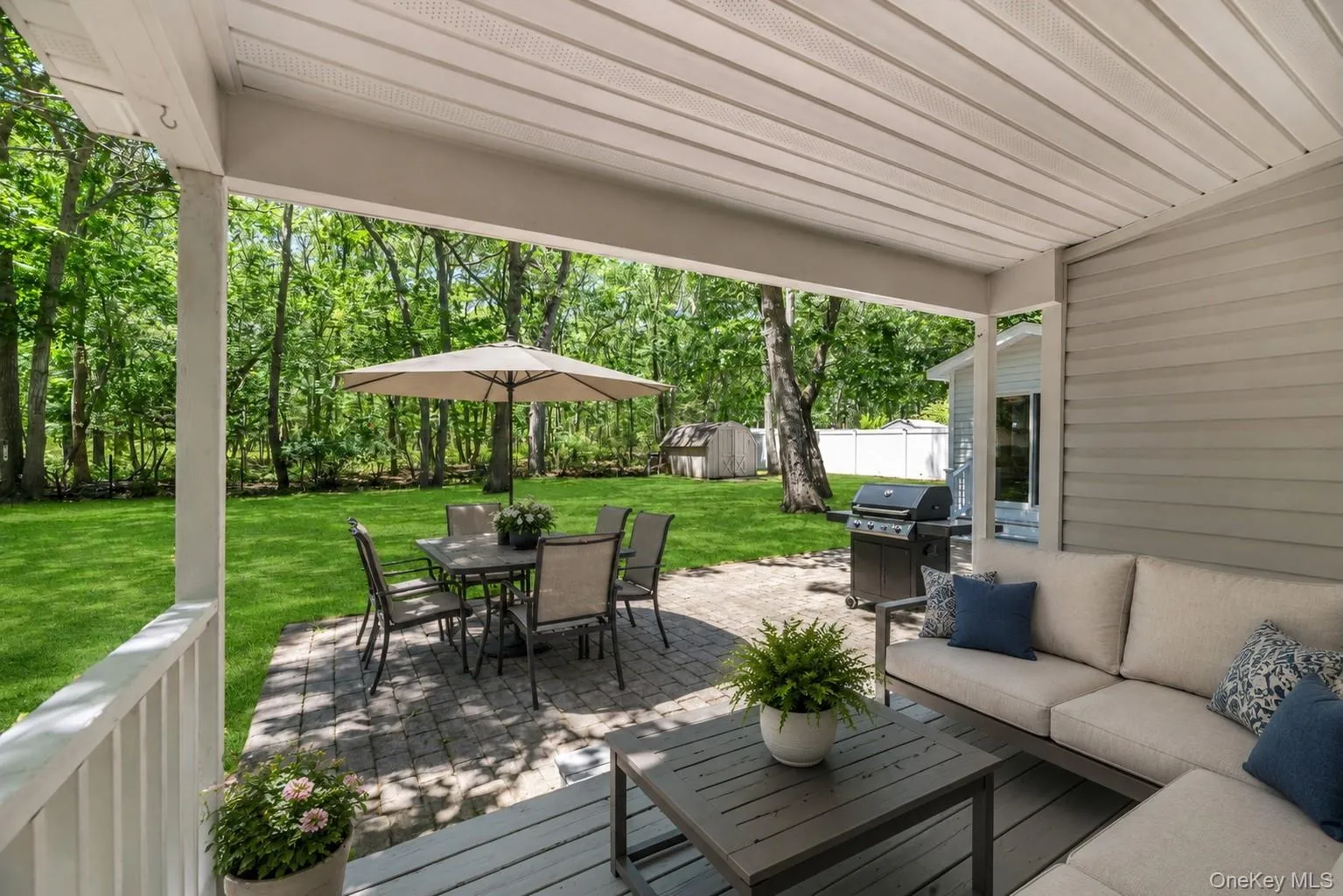 A deck and patio create inviting spaces for outdoor entertaining. A deck and patio create inviting spaces for outdoor entertaining.
