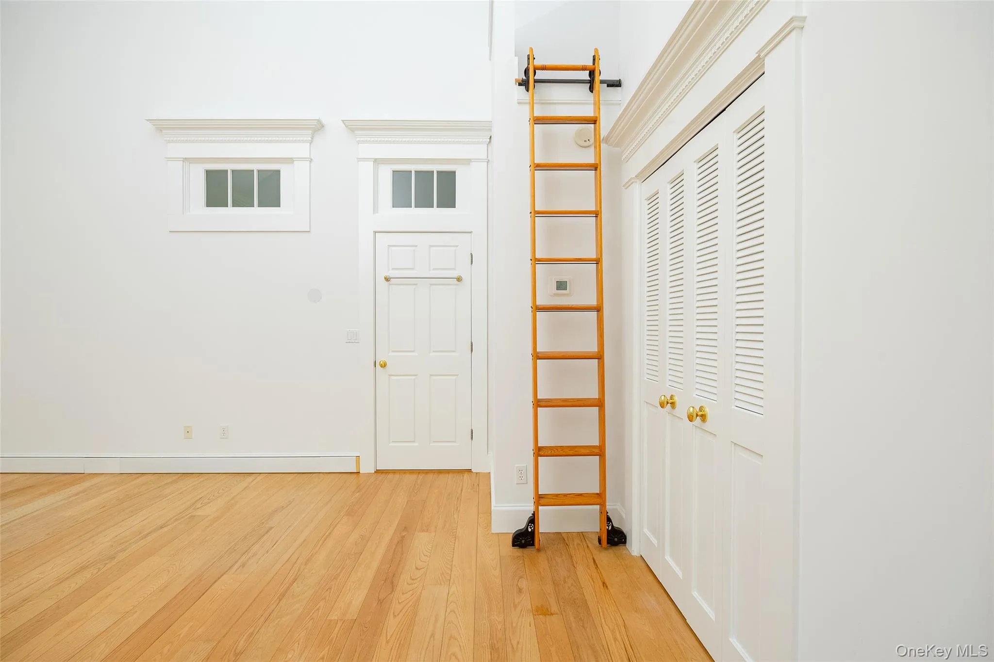 Large bedroom with ladder to loft area Large bedroom with ladder to loft area