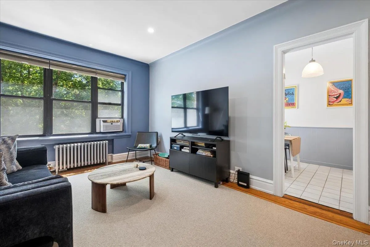 Living room w/ large windows Living room w/ large windows